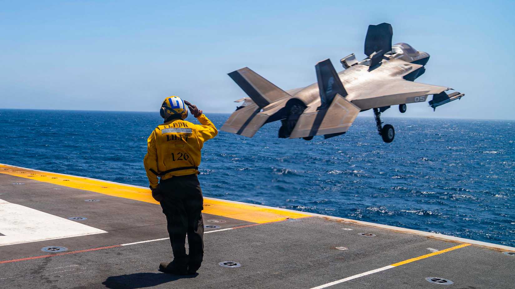 An F-35B Lighting II, attached to Marine Fighter Attack Squadron (VMFA) 121, takes off from the flight deck of USS Tripoli (LHA 7).