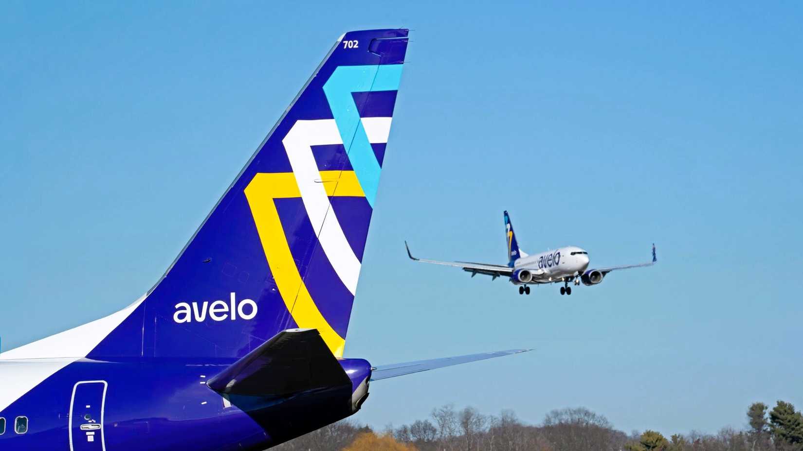 Avelo Airlines Boeing 737-800 tail with plane landing