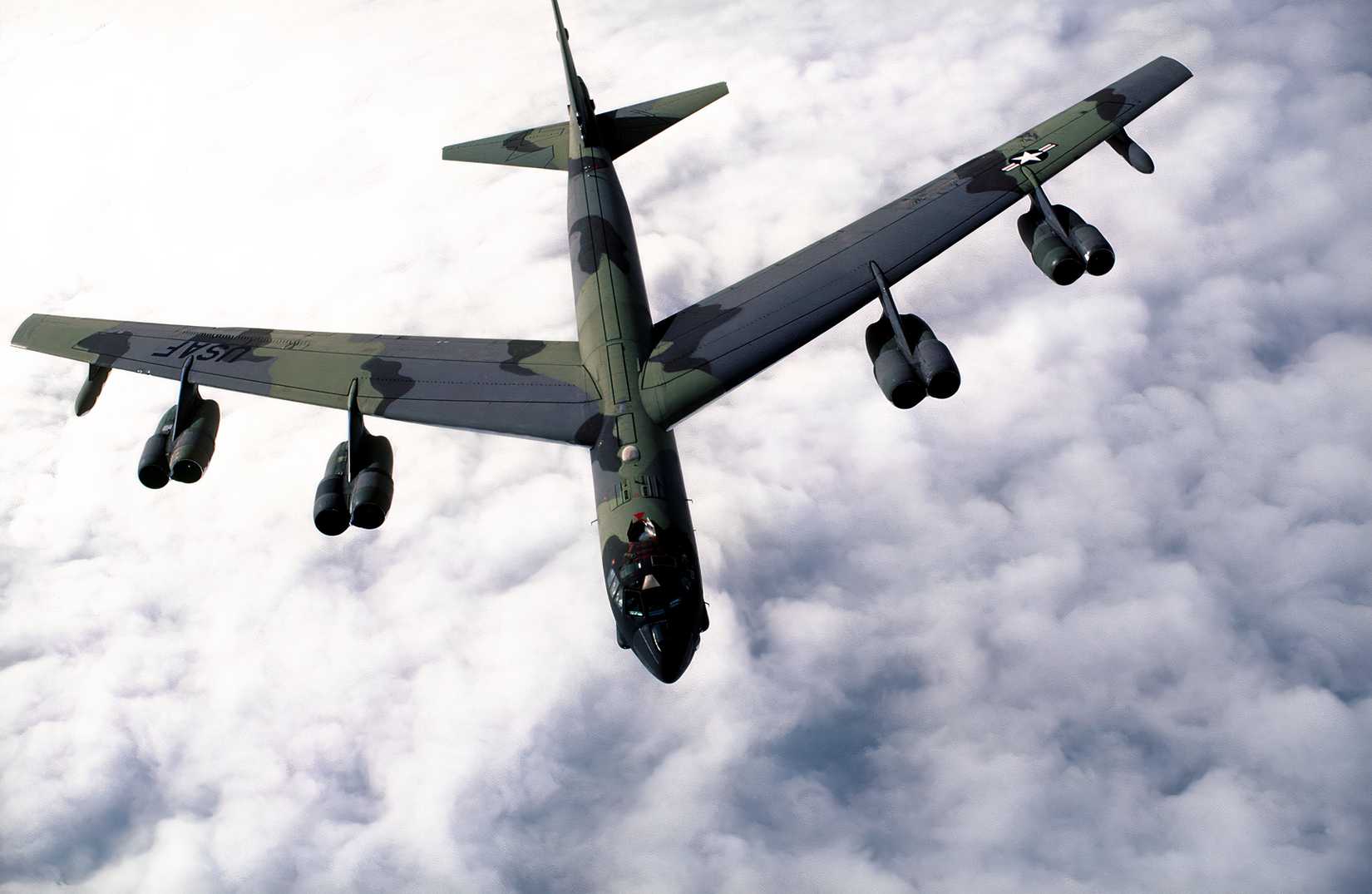 Image of a B-52 flying above the clouds.