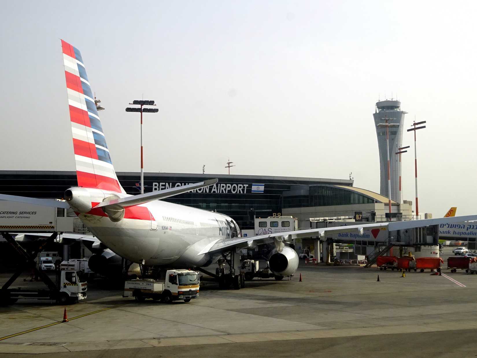 Ben Gurion airport terminal with American airlines plane.