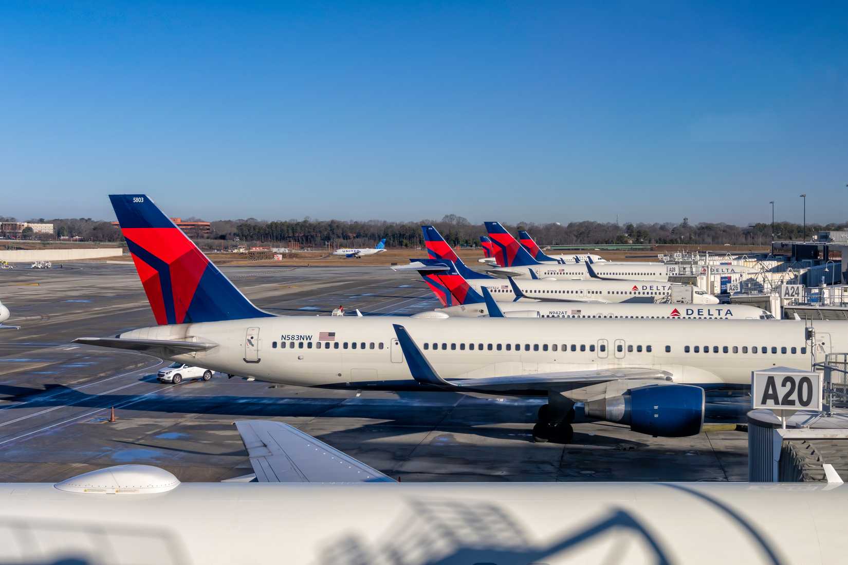Delta Air Lines aircraft at gate Atlanta airport lined up