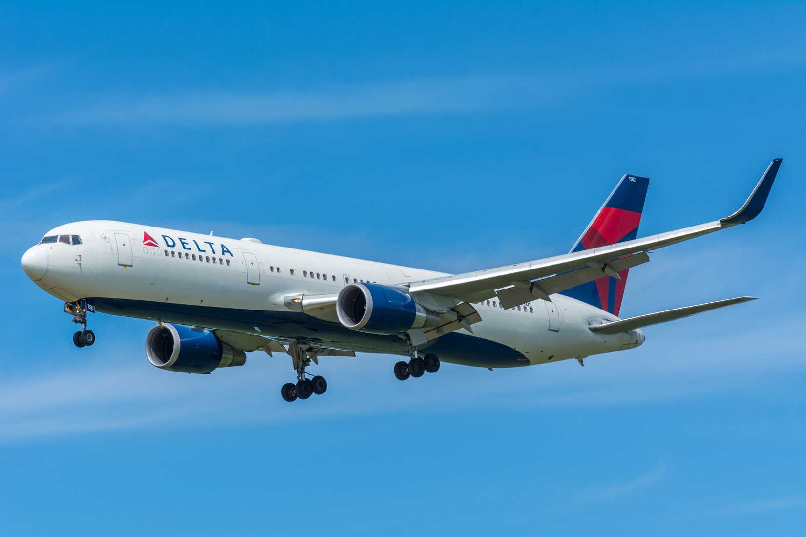 Delta Air Lines Boeing 767-300 flying across clear skies