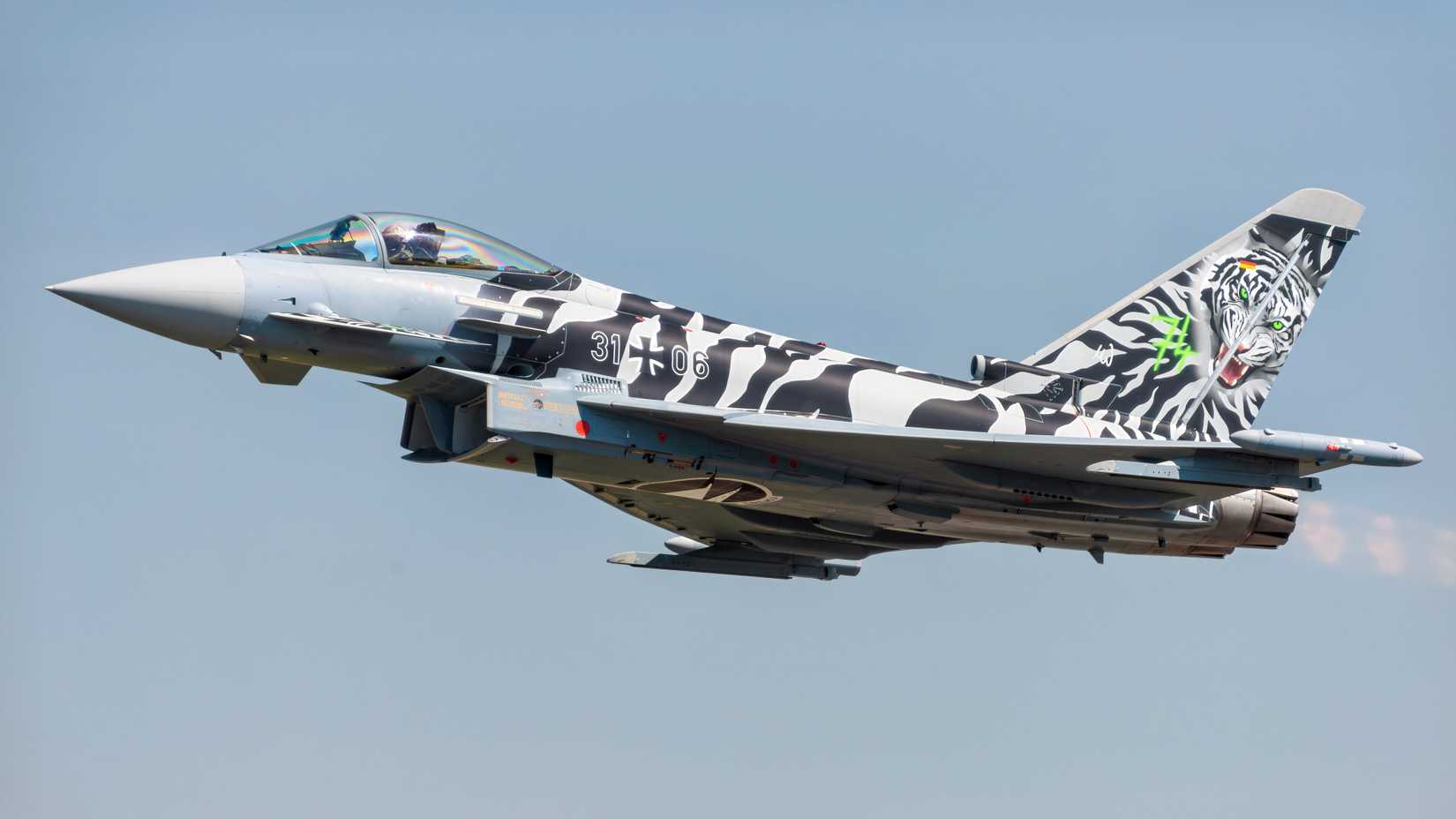 Eurofighter from the German air force flying, with view of the side of the aircraft. 