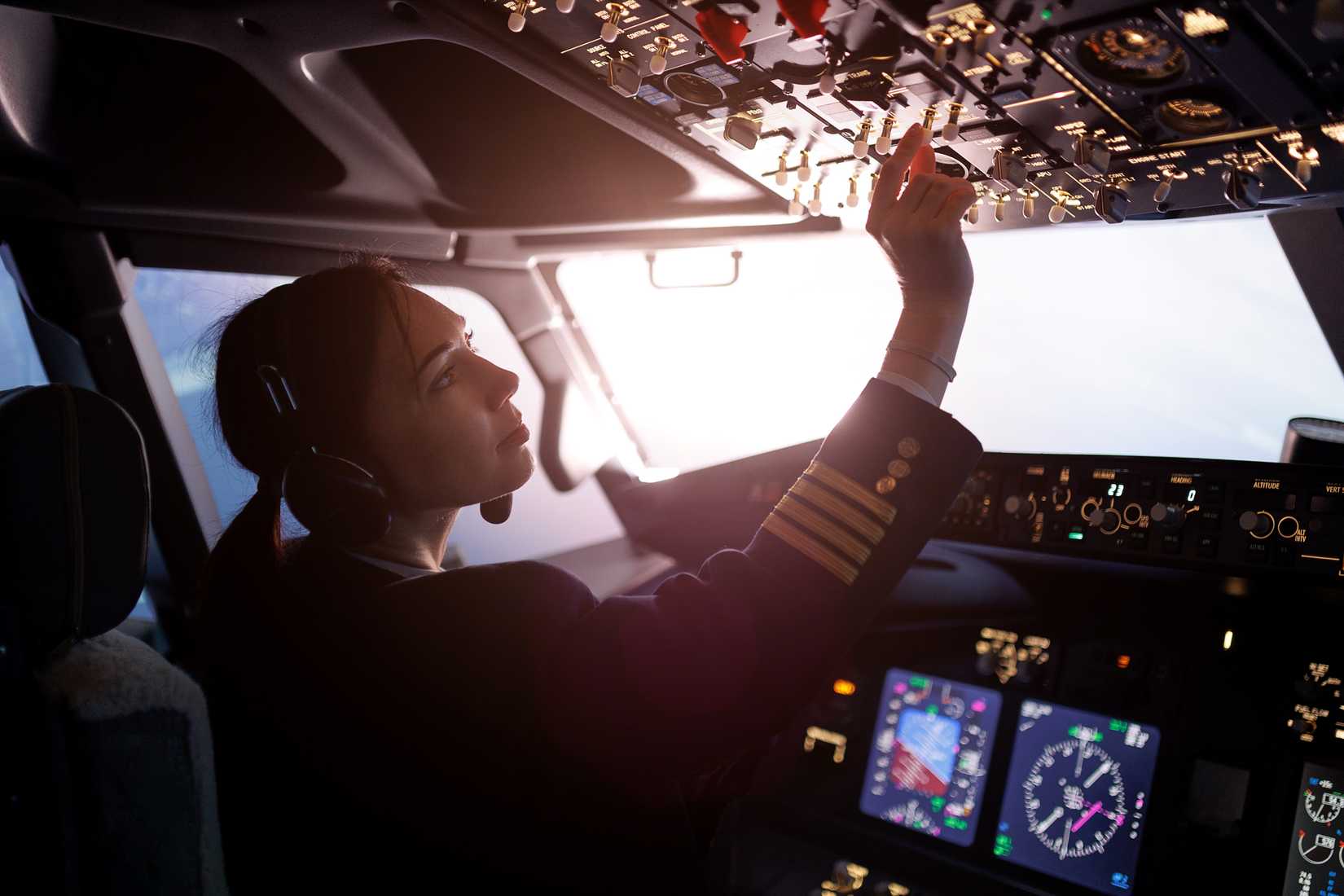 female pilot in cockpit