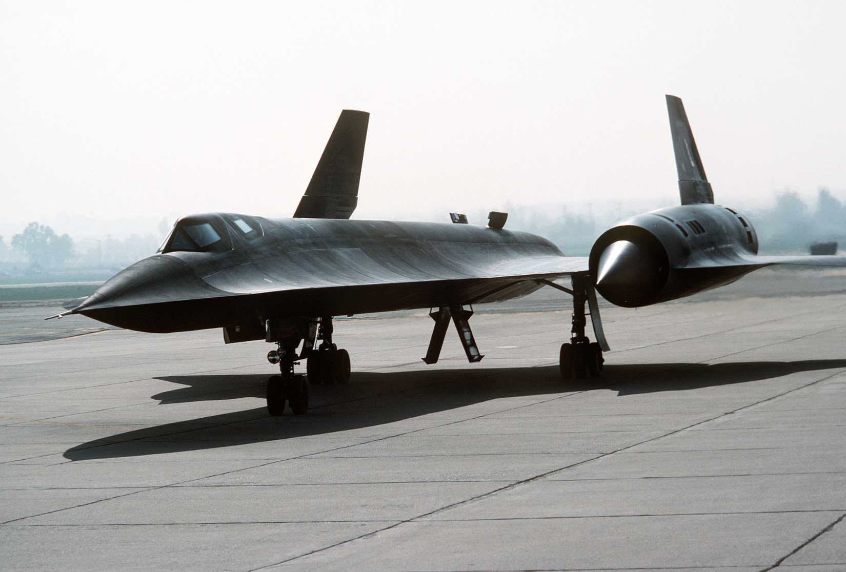 Heat waves radiate from the engines of a 9th Strategic Reconnaissance Wing SR-71 aircraft following its arrival on base for its deactivation ceremony.