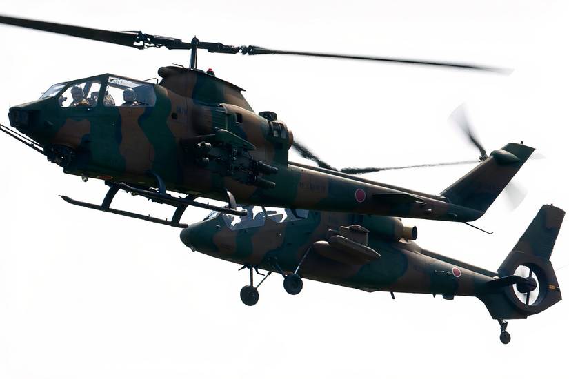 A Japanese Fuji AH-1S Cobra flying with an OH-1 Ninja.