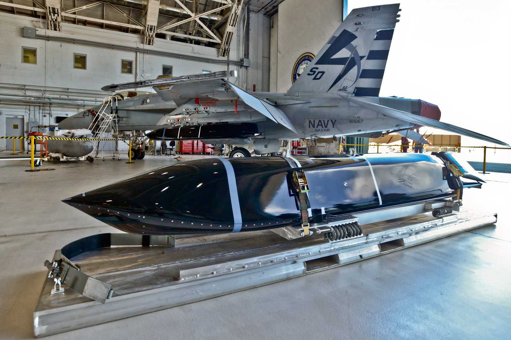US Navy F/A-18 seen behind an LSRAM anti-ship missile
