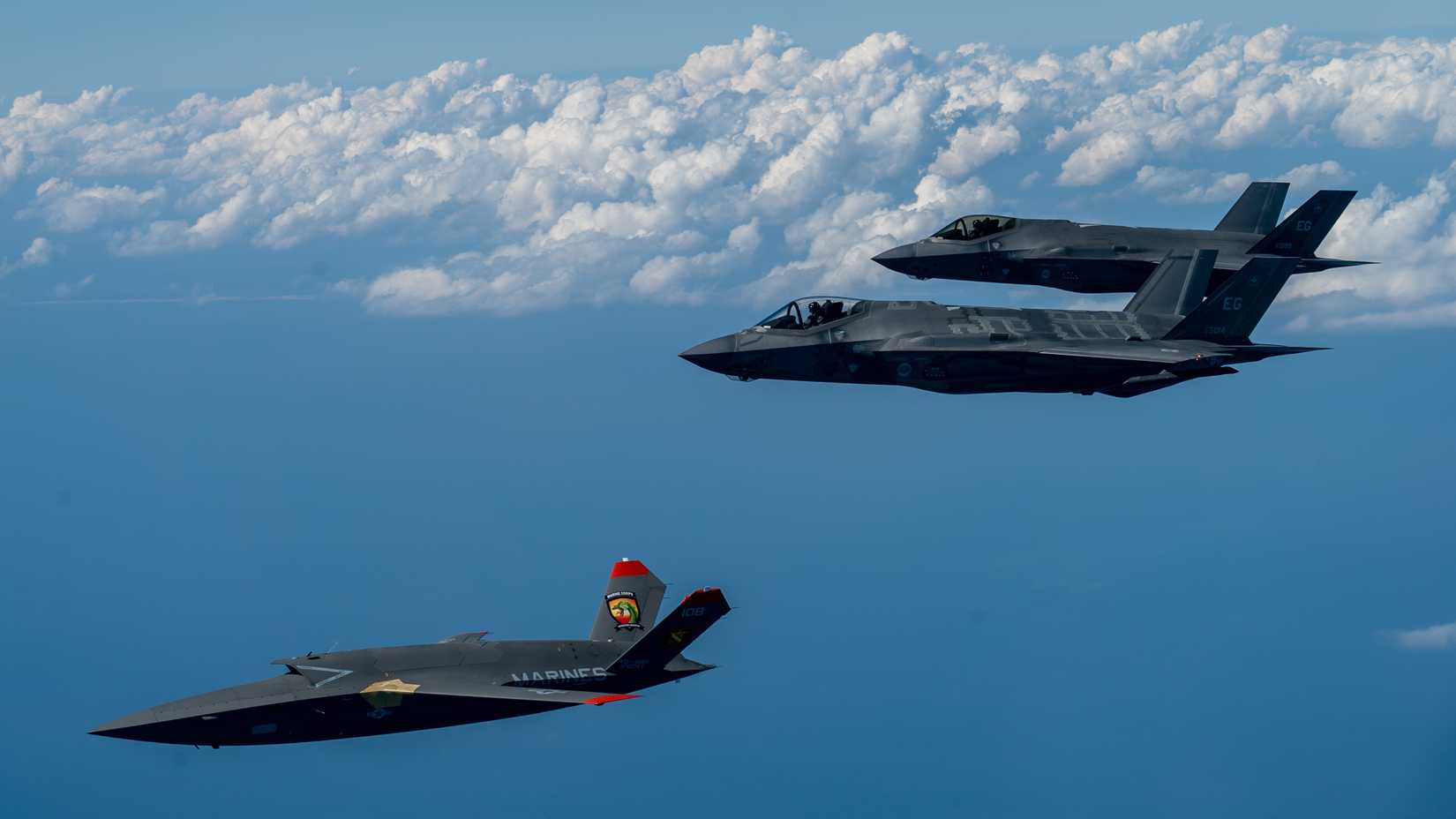 Marine Corps XQ-58A Valkyrie, highly autonomous, low-cost tactical unmanned air vehicle, conducts its second test flight with two U.S. Air Force F-35A Lightning II aircraft.