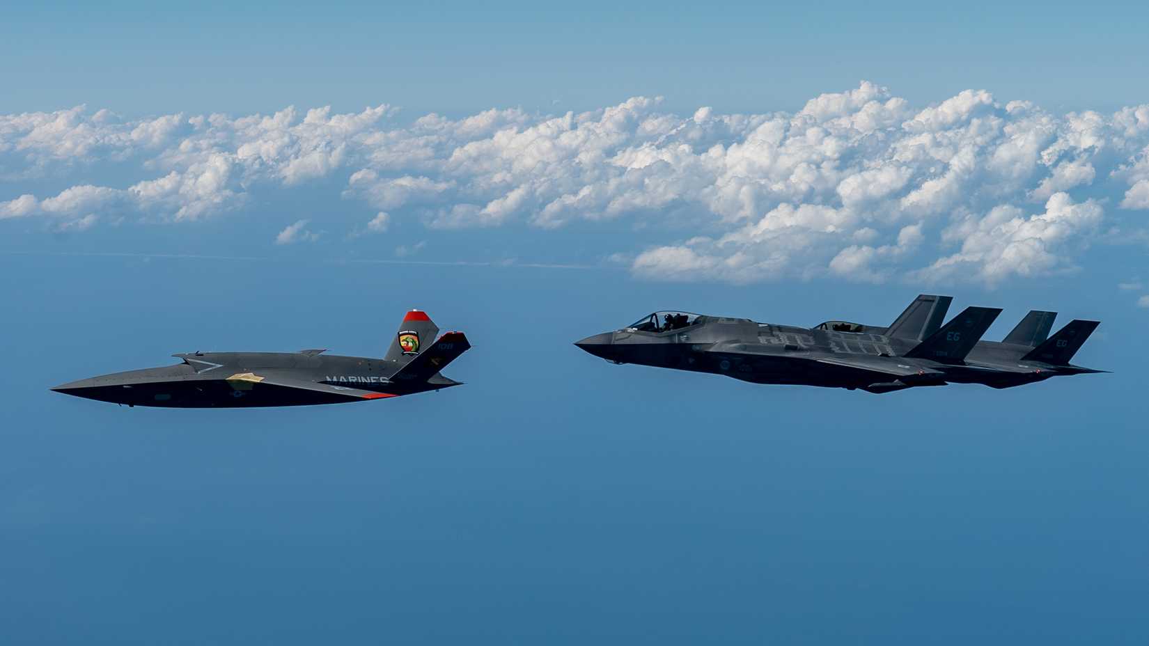 Marine Corps XQ-58A Valkyrie, highly autonomous, low-cost tactical unmanned air vehicle, conducts its second test flight with two U.S. Air Force F-35A Lightning II.
