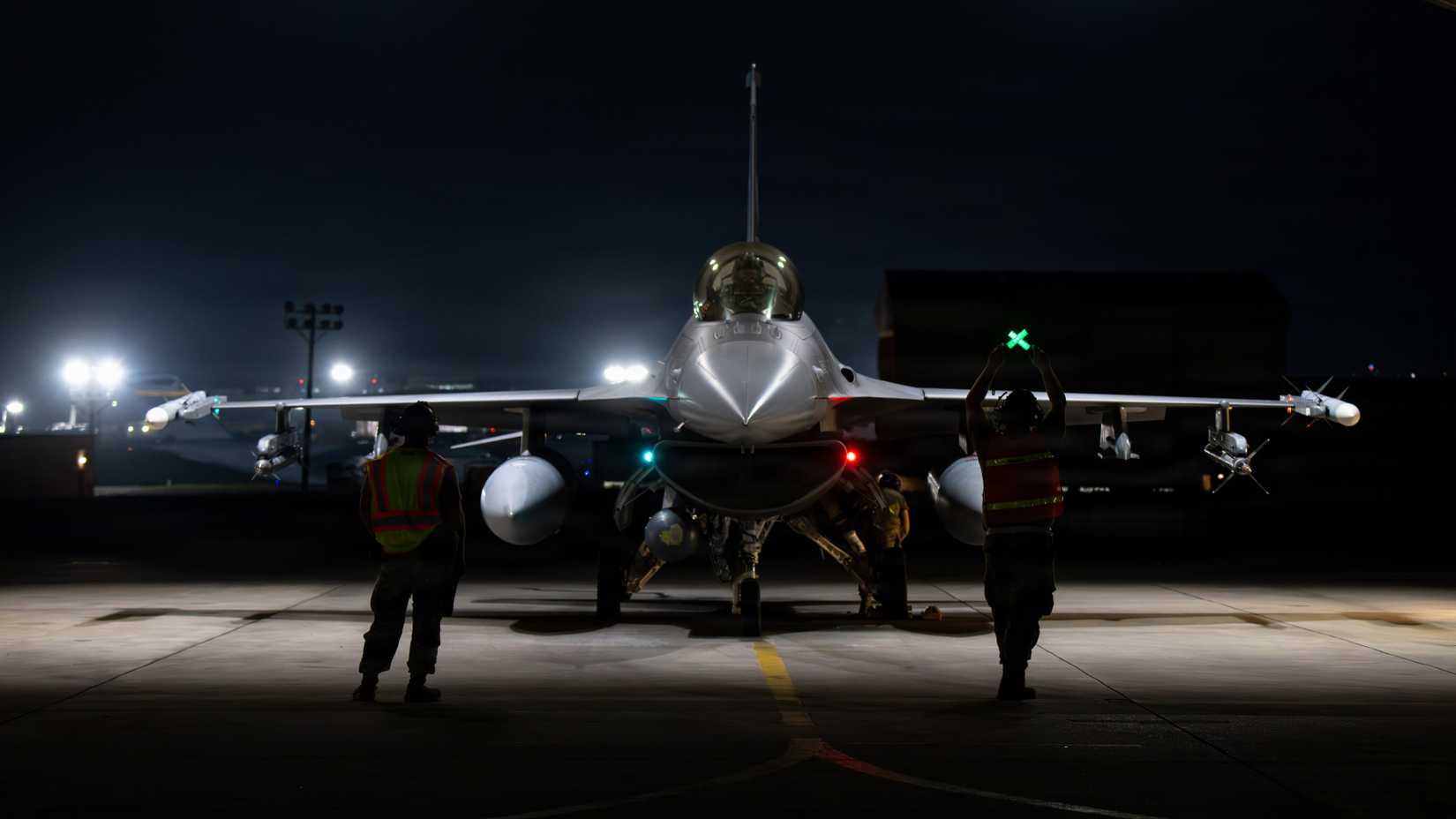 Members of the Colorado Air National Guard prepare an F-16C Fighting Falon for a flight during night flying operations at Kadena Air Base, Japan, April 14, 2026.