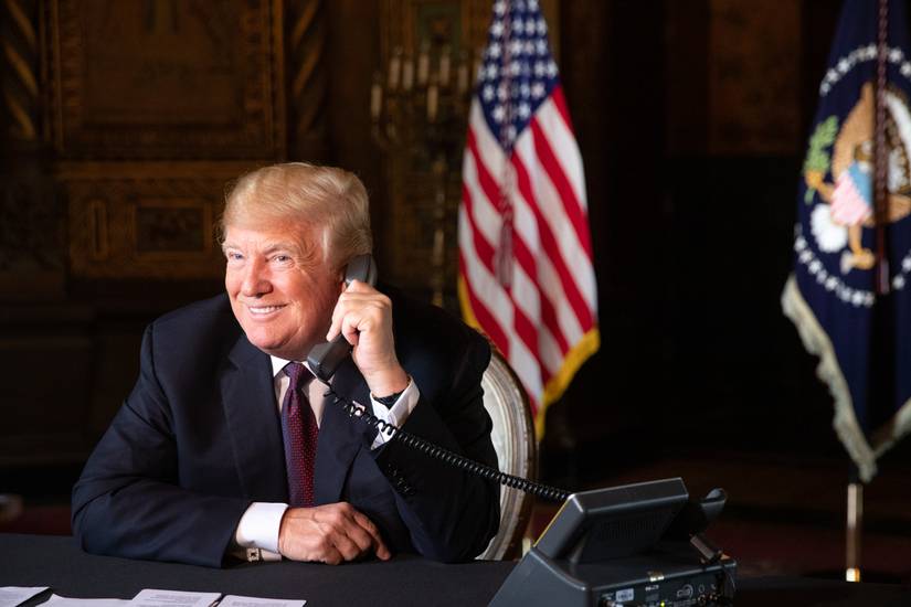President Donald J. Trump speaks with military service personnel, Thursday, Nov. 22, 2018, during a Thanksgiving conference call at Mar-a-Lago in Palm Beach, Fla.