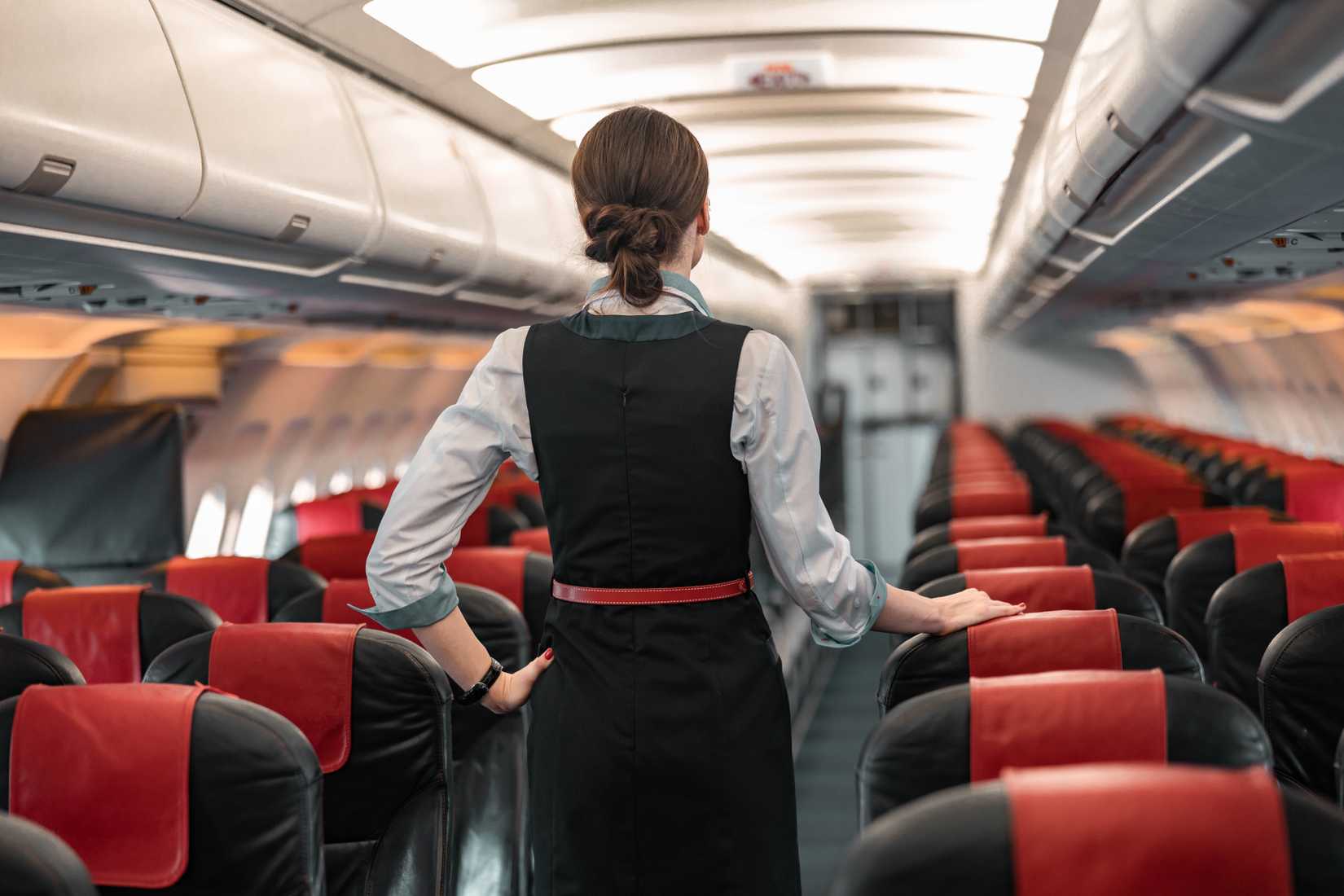 flight attendants standing in cabin