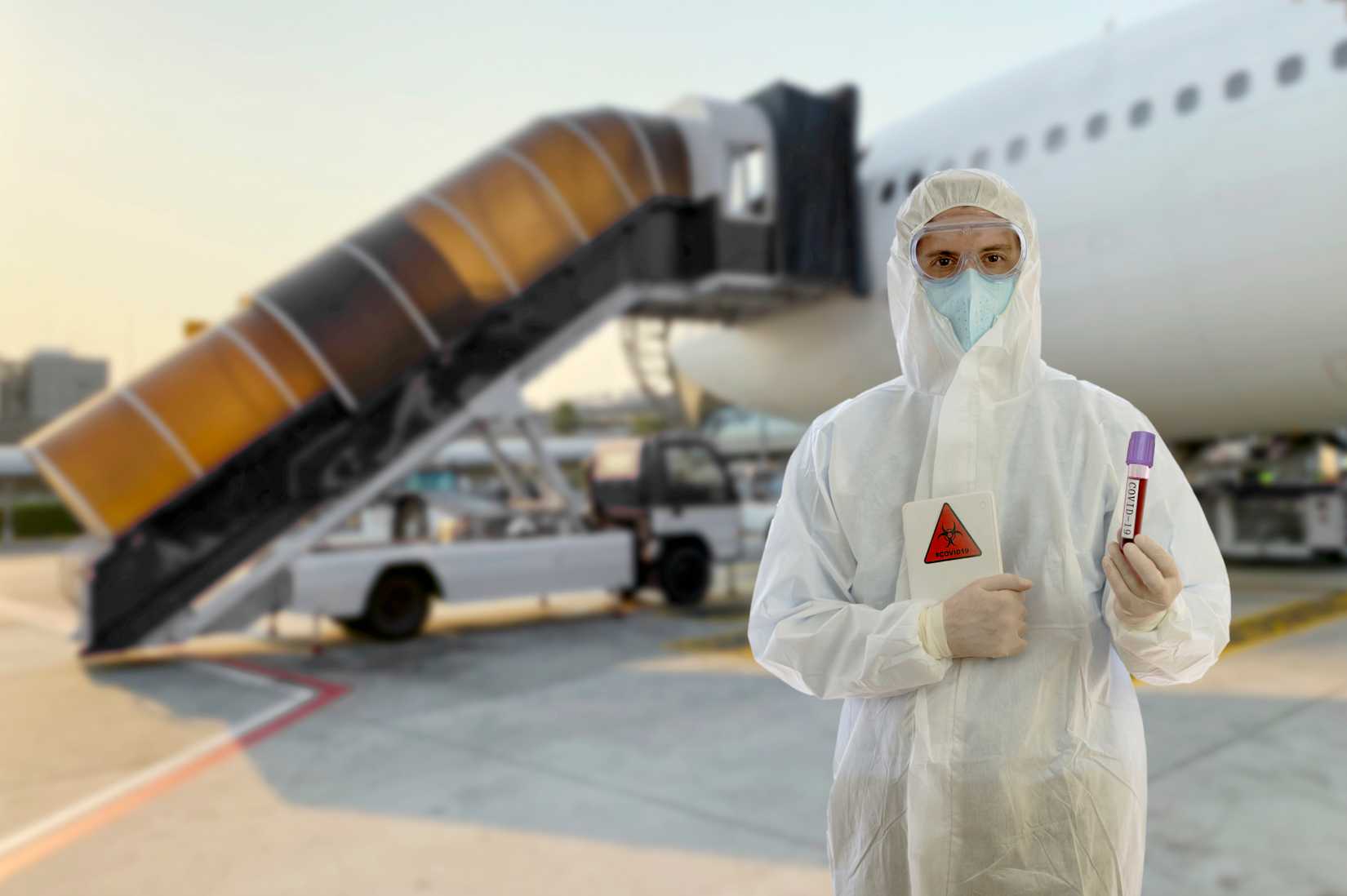 Aircraft and a man dressed in coveralls during the pandemic