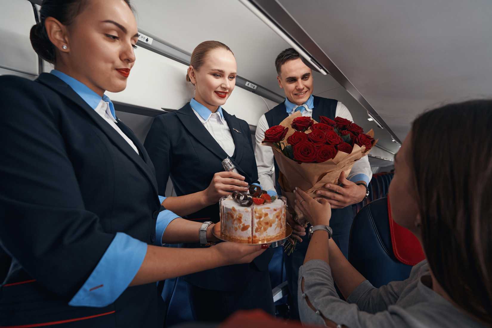 flight attendants with gifts for passenger