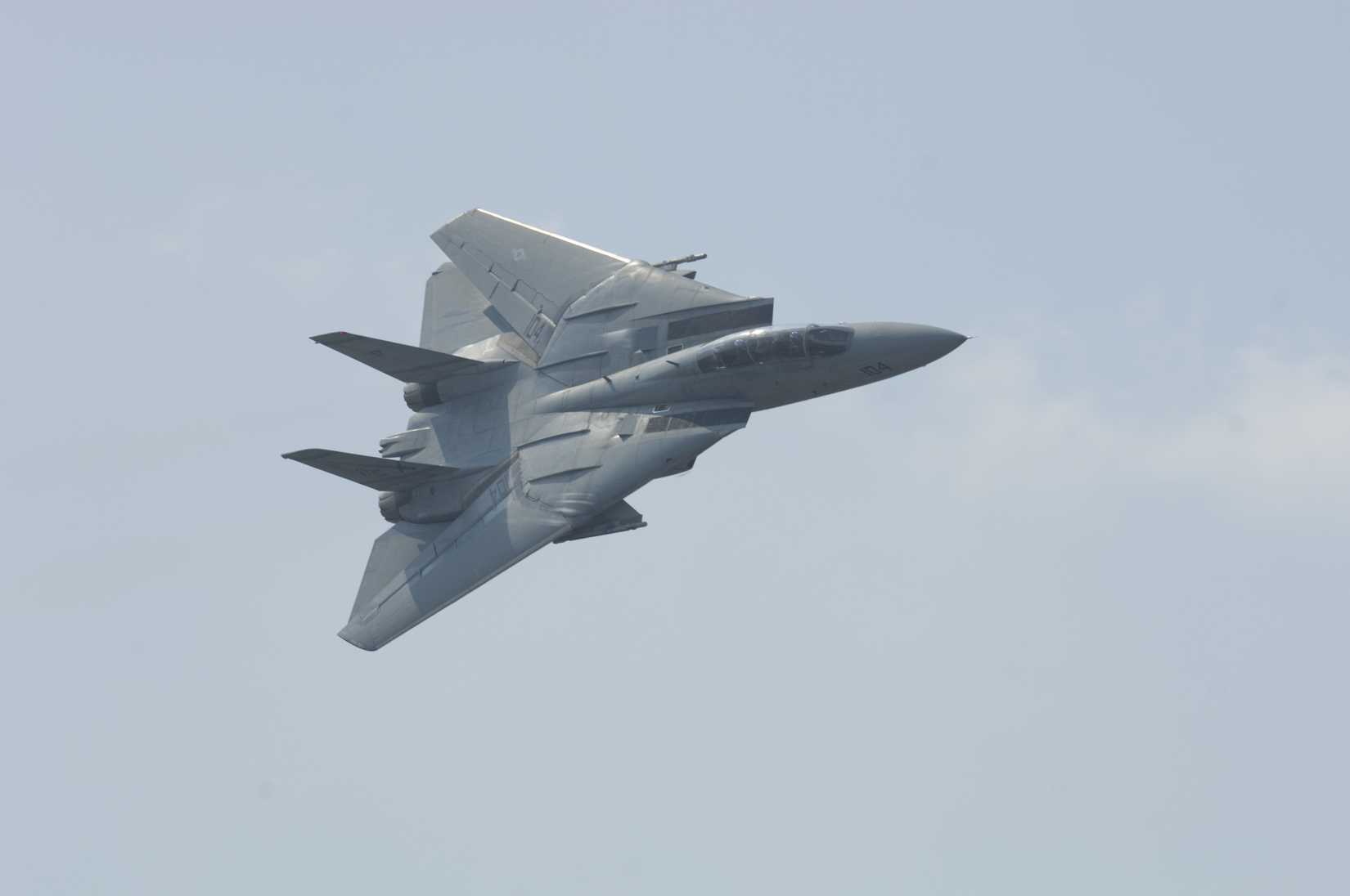 Virginia Beach, VA - Sept 17: A US Navy F-14 performs a high G-turn during the second to last performance prior to retirement at the NAS Oceana airshow on September 17, 2005 in Virginia Beach, 