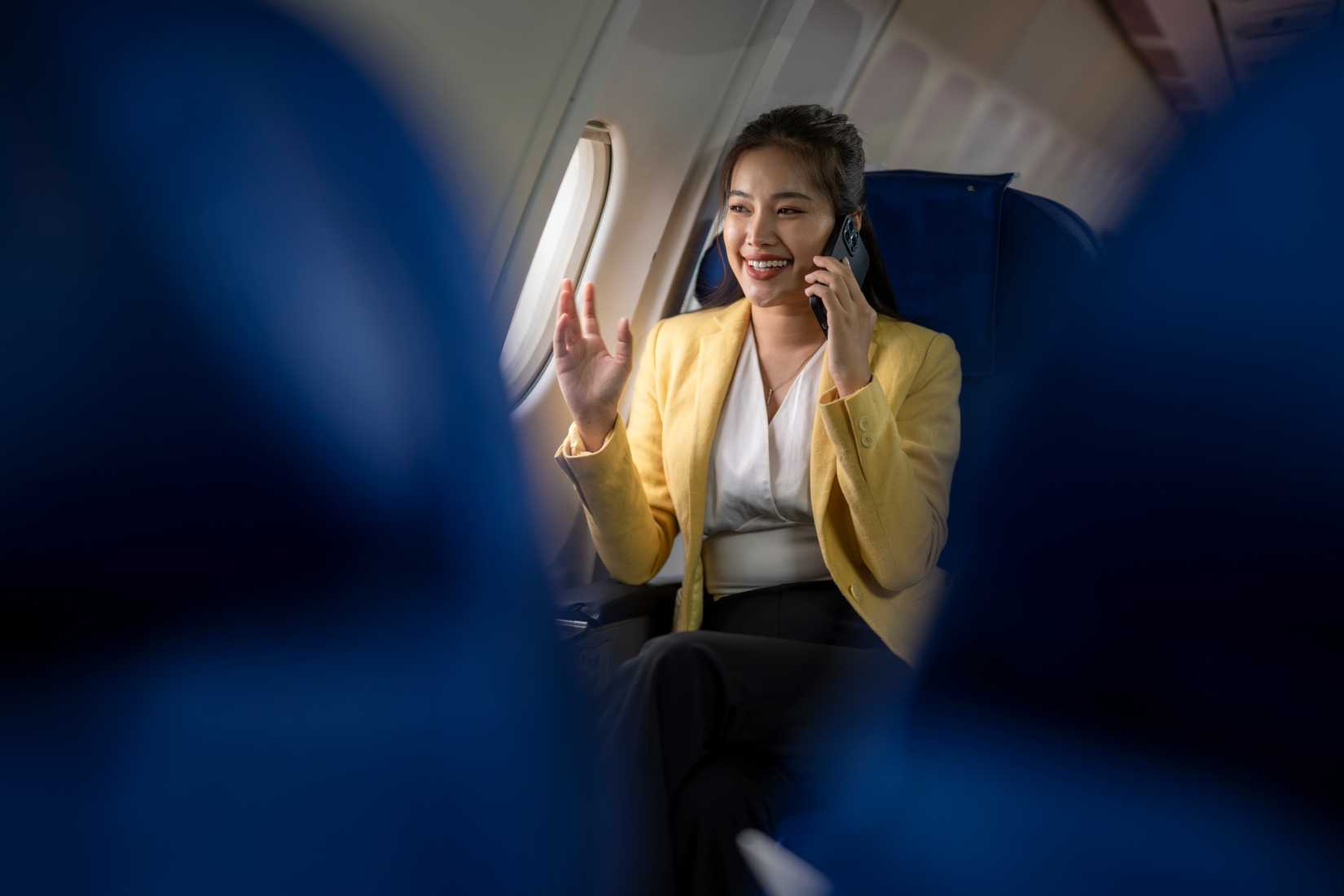 female passenger smiling talking on phone