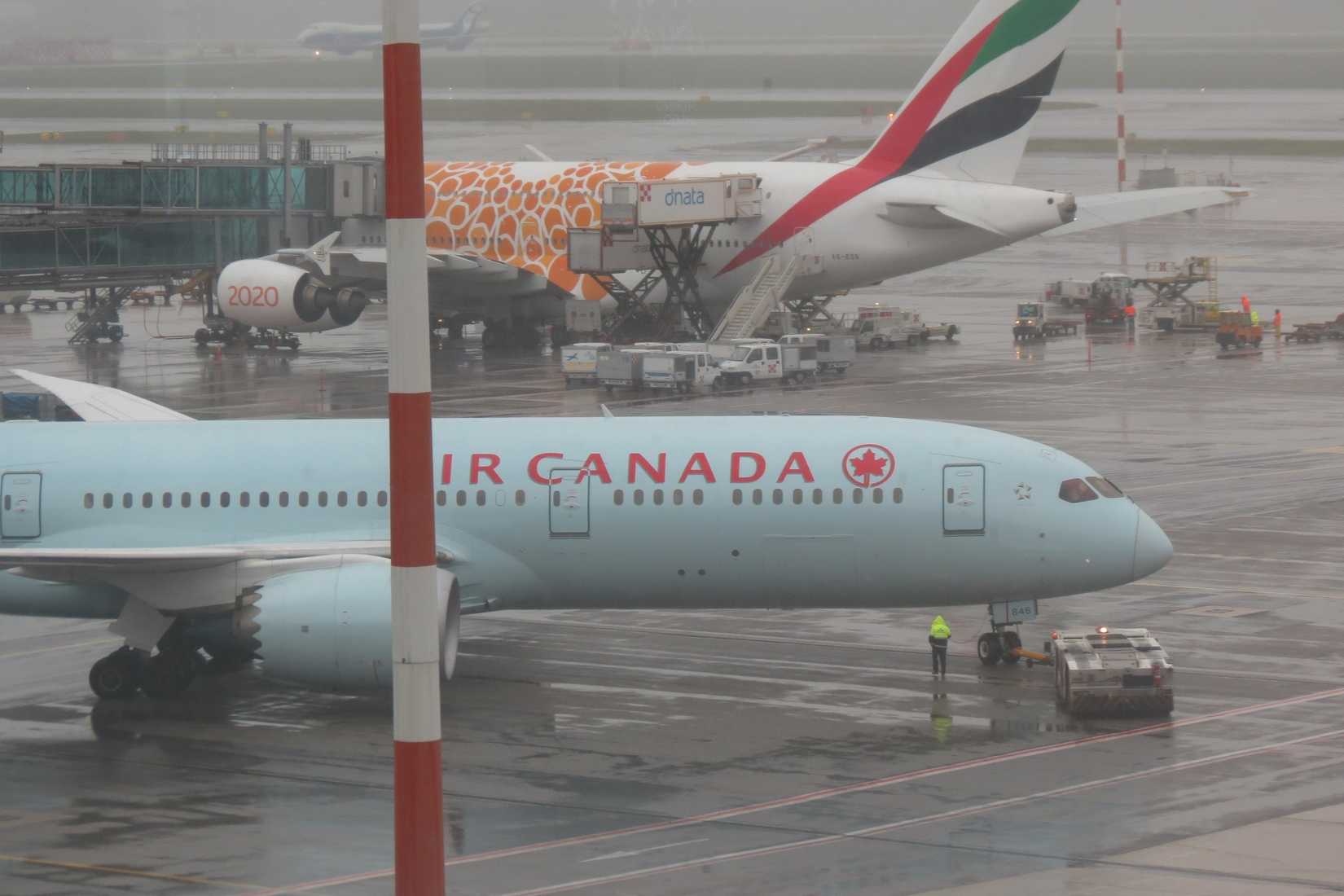 Air Canada Boeing 787-9 Being Pushed Back With Emirates A380 In The Background