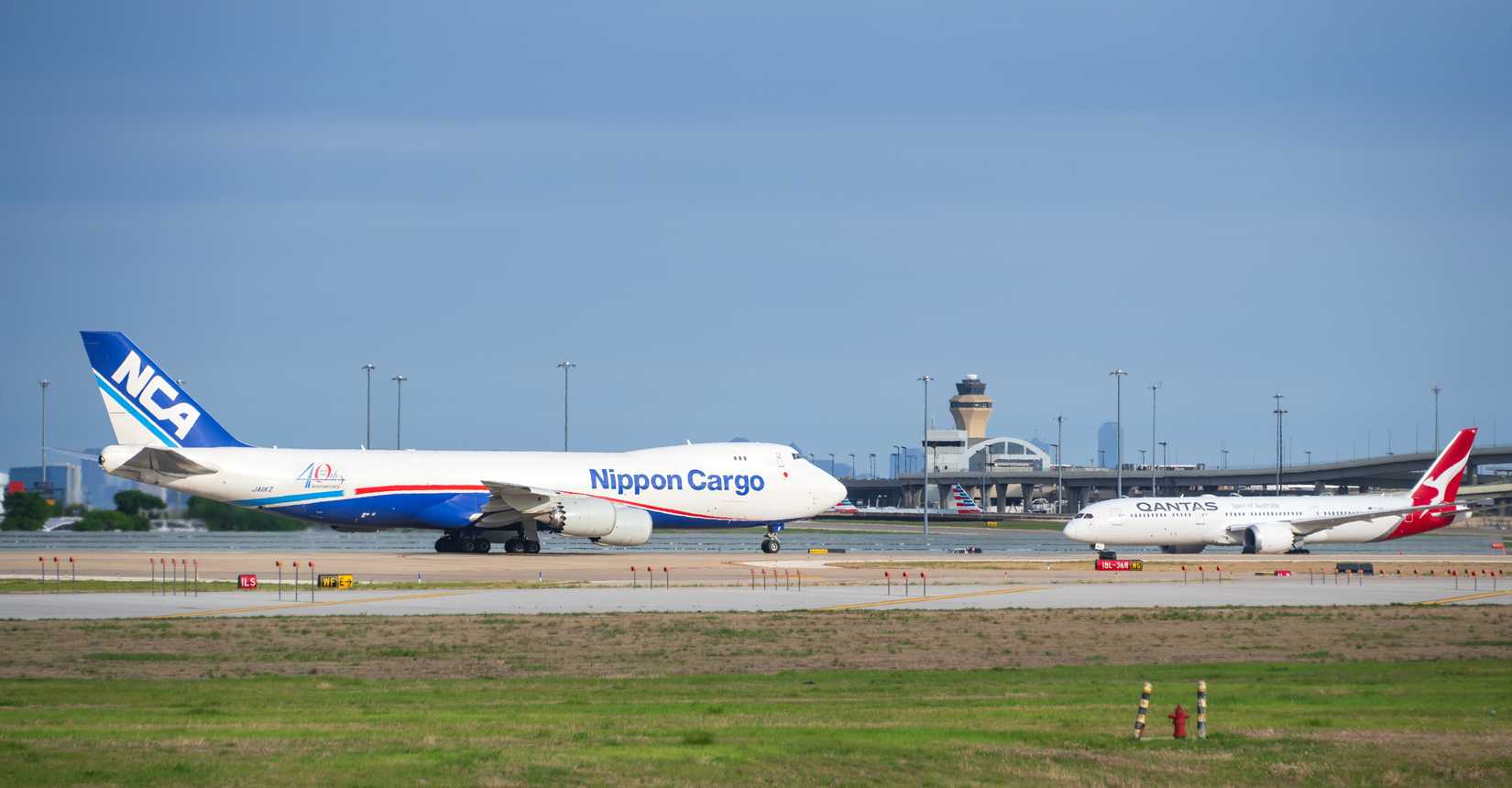 Nippon Cargo Airlines aircraft Boeing 747-8F and Qantas Airways Boeing 787 Dreamliner 