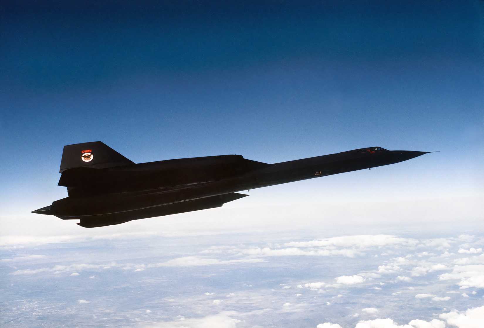 An SR-71 flying above the clouds with a view of the earth below