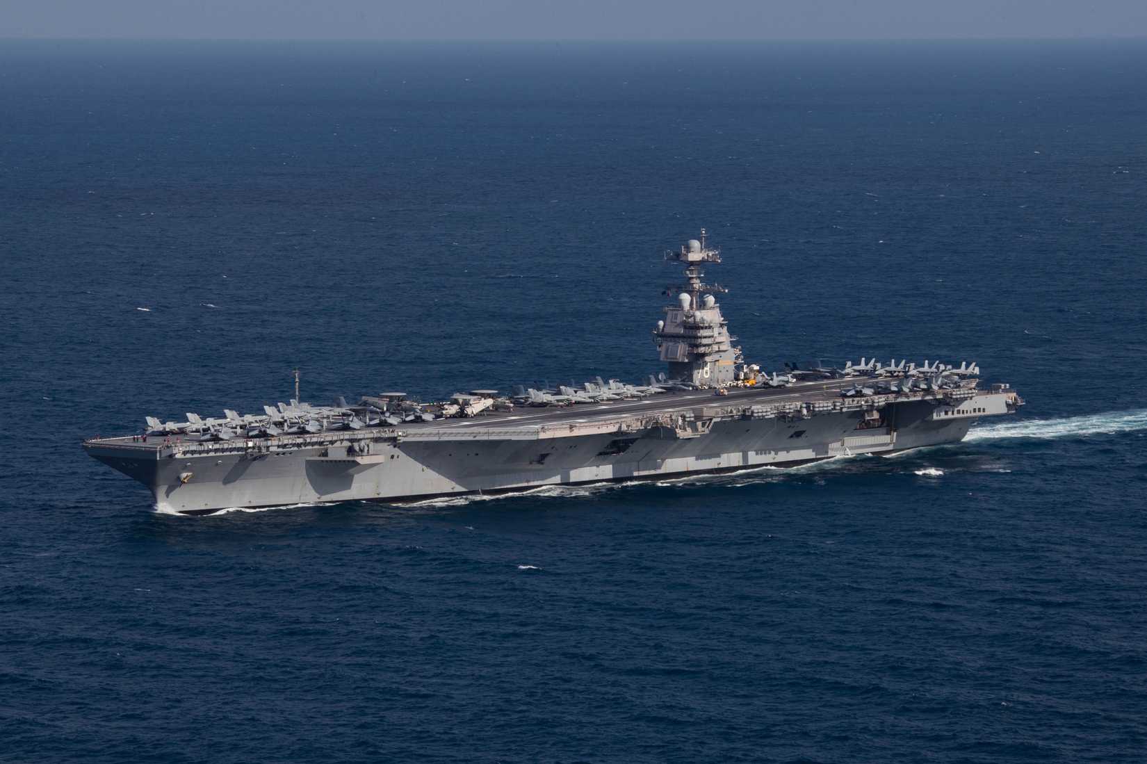 The U.S. Navy aircraft carrier USS Gerald R. Ford (CVN-78) steams the Atlantic Ocean during a simulated straits transit with the Gerald R. Ford Carrier Strike Group (GRFCSG) in the Atlantic Ocean, 9 October 2022. The Gerald R. Ford Carrier Strike Group was deployed in the Atlantic Ocean, conducting training and operations alongside NATO allies and partners since 5 October 2022. On deck are aircraft of Carrier Air Wing 8 (CVW-8).