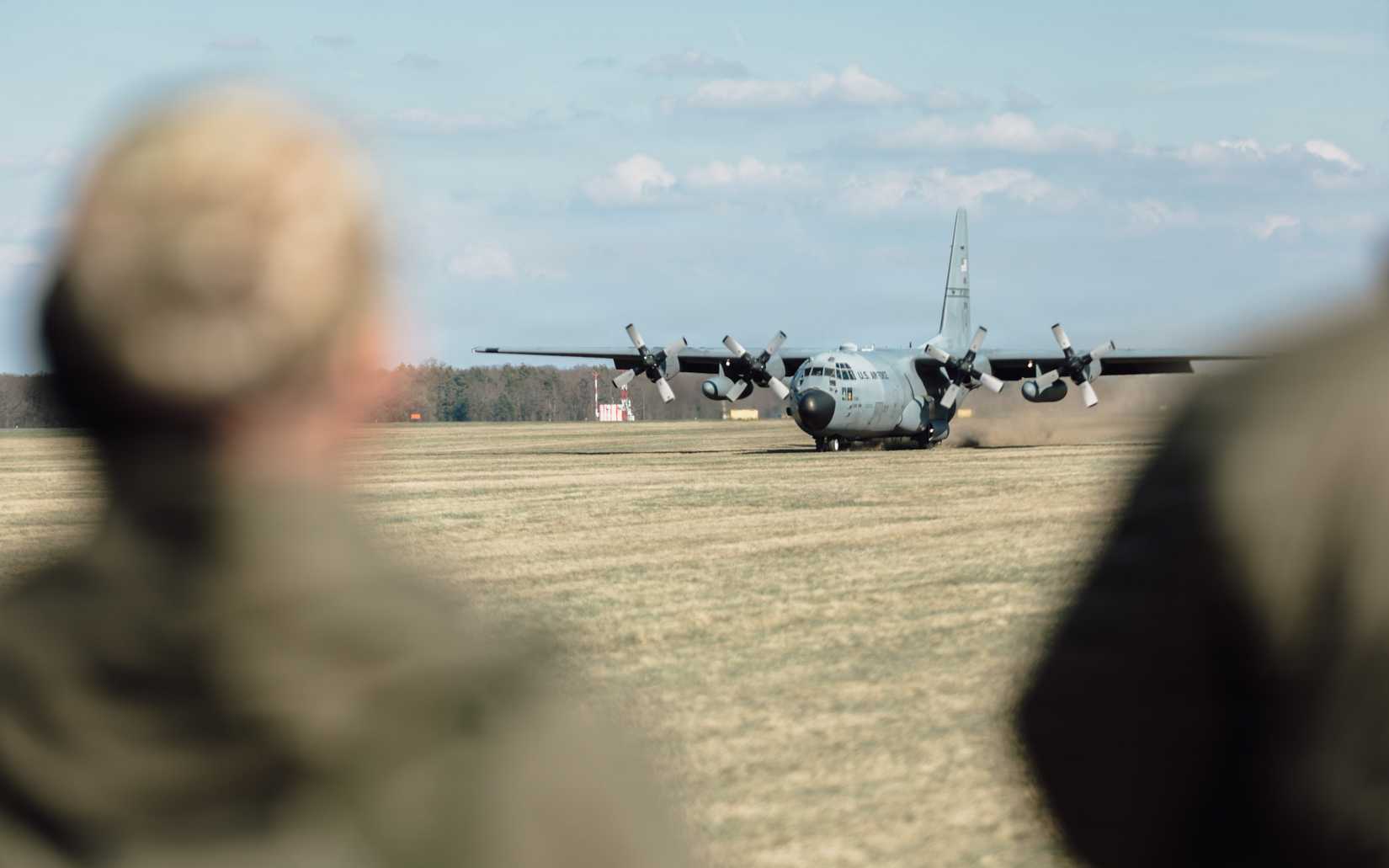 A C-130H Hercules aircraft from the 139th Airlift Wing, Missouri Air National Guard, flies over a drop zone in support of Hussar Saber 26-1 at 33rd Air Base, Powidz, Poland.