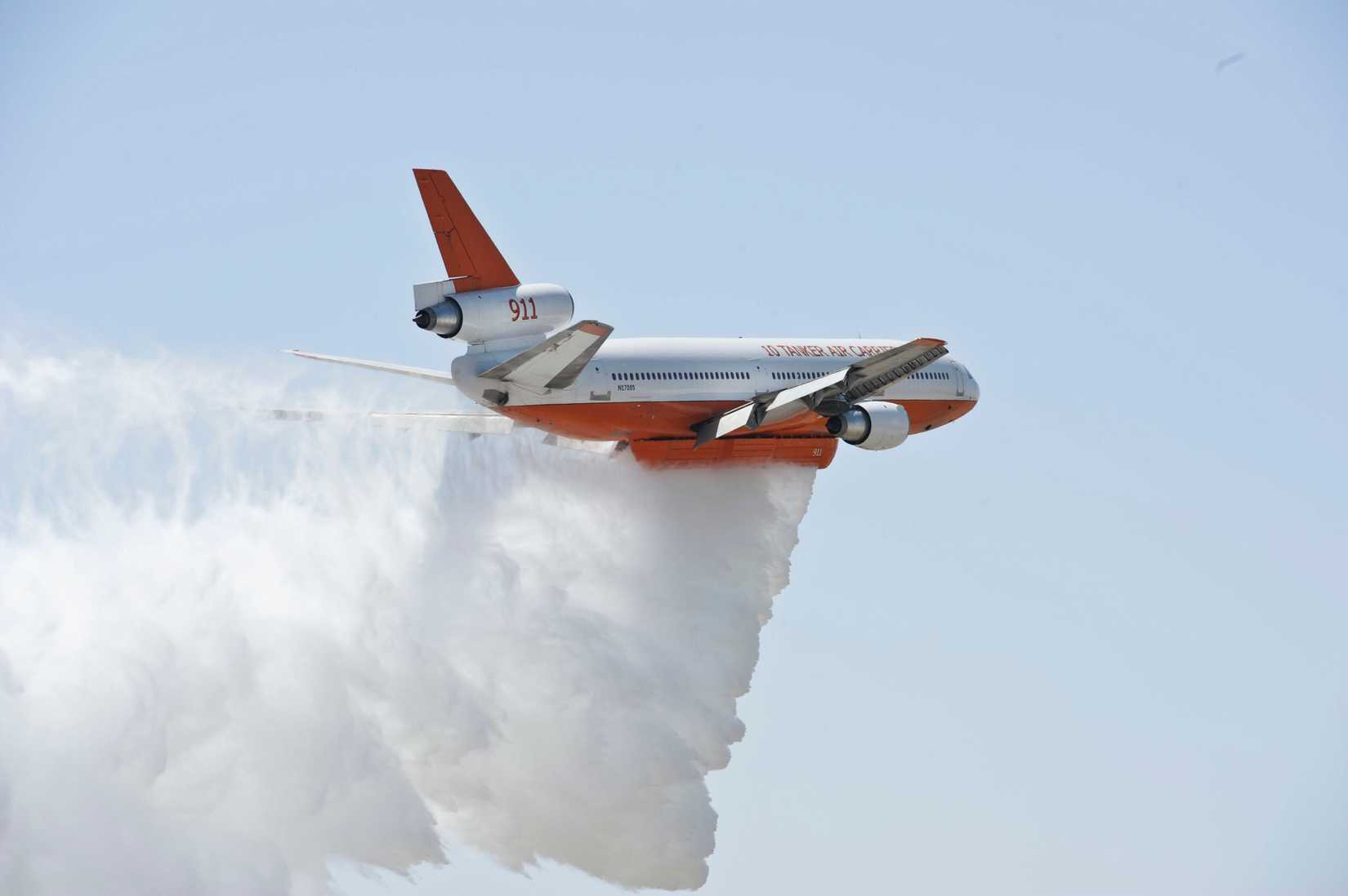 A DC-10 Tanker with the U.S. Forest Service demonstrates a water drop during Thunder Over The Empire Air Fest at March Air Reserve Base, Calif., May 19, 2012.
