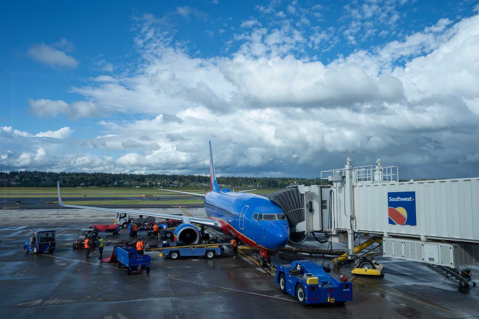 A jetliner operated by Southwest Airlines is seen parked at a terminal gate in Portland International Airport (PDX)