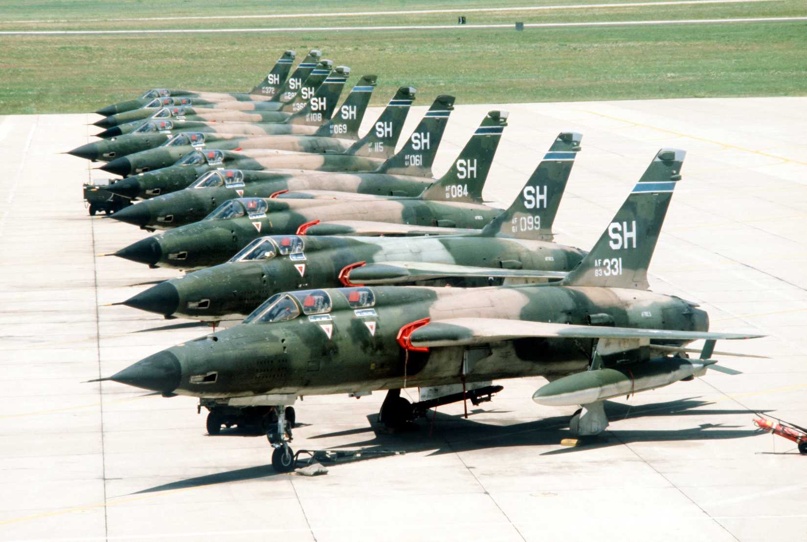 A left front view of 507th Tactical Fighter Group F-105 Thunderchief aircraft parked on the flight line