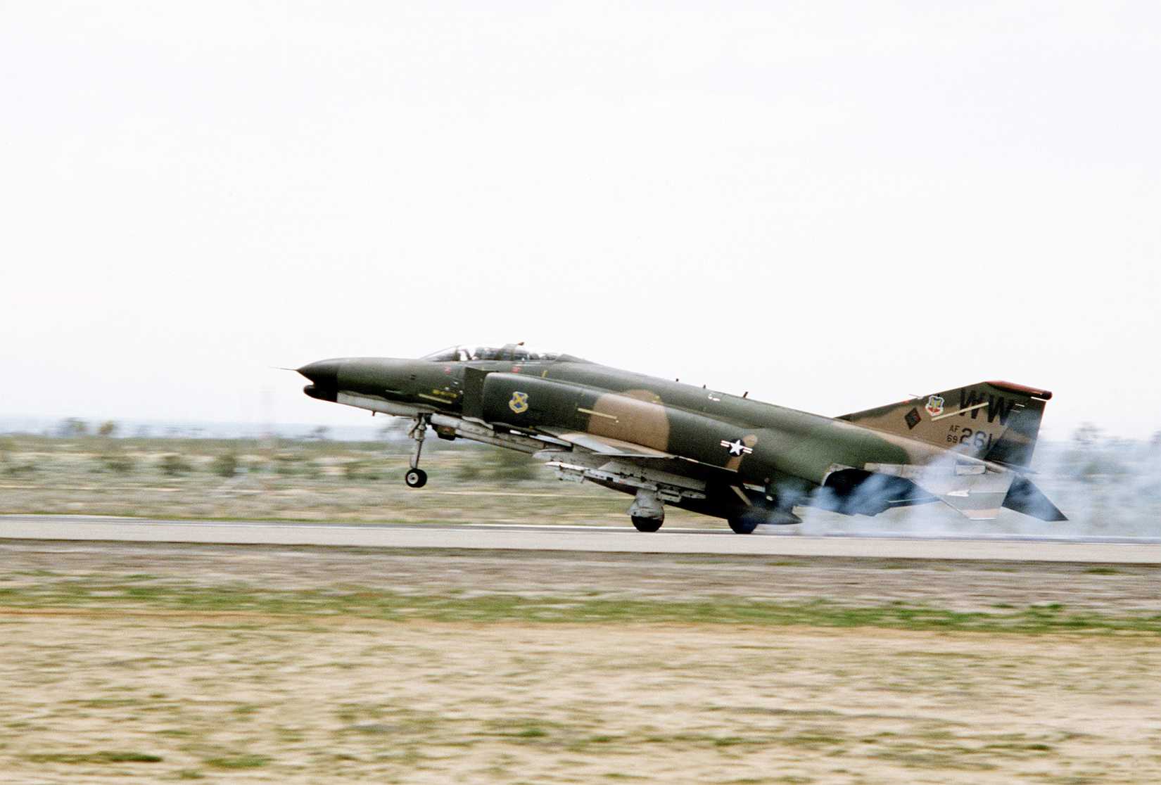 A left side view of an F-4 Phantom II aircraft taking off during Exercise Gallant Eagle '82.