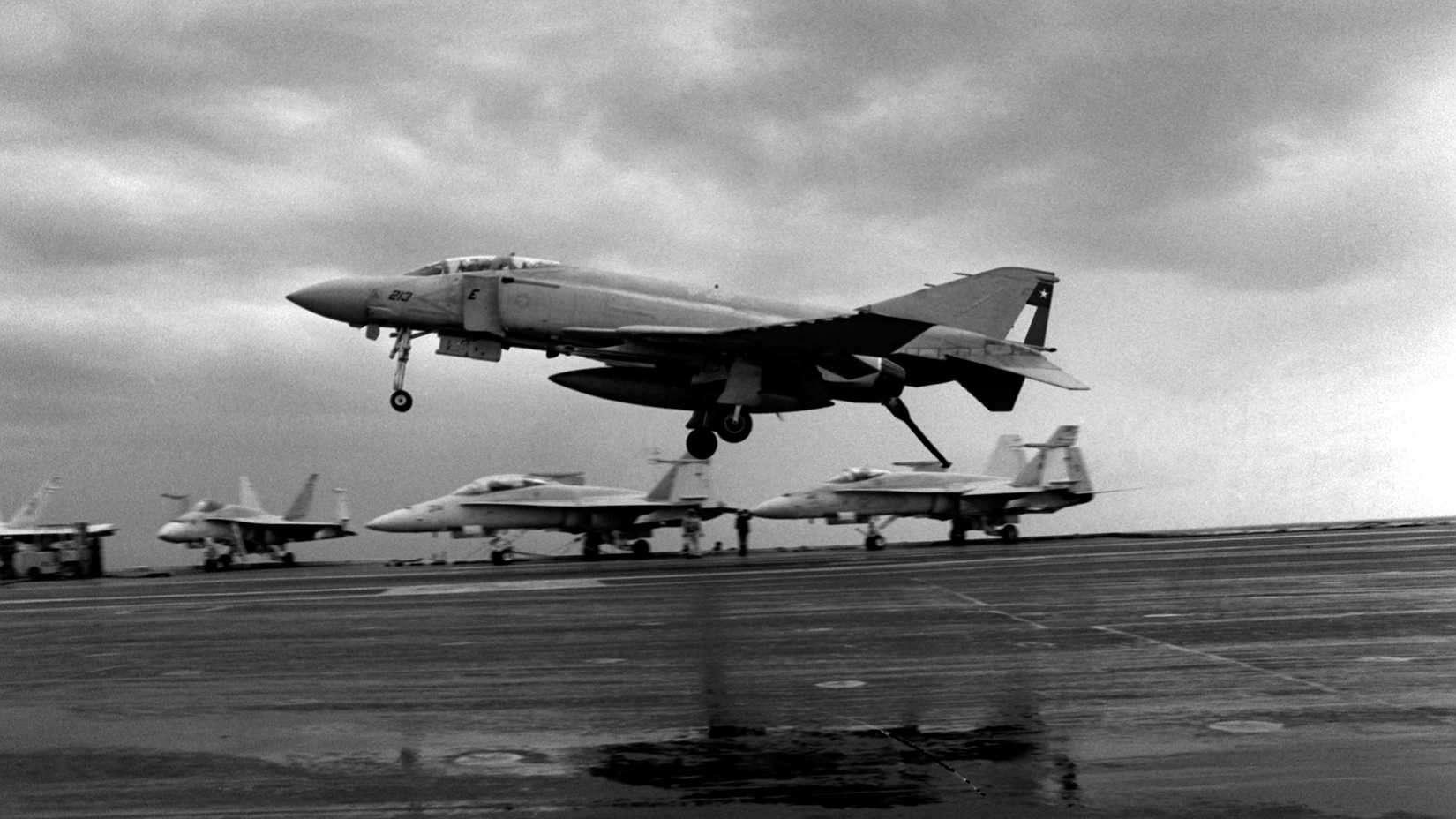 A Naval Air Reserve F-4S Phantom II aircraft from Fighter Squadron 202 (VF-202) lands aboard the aircraft carrier USS AMERICA (CV-66). This is the last operational landing by a Navy F-4 aboard a U.S. aircraft carrier.