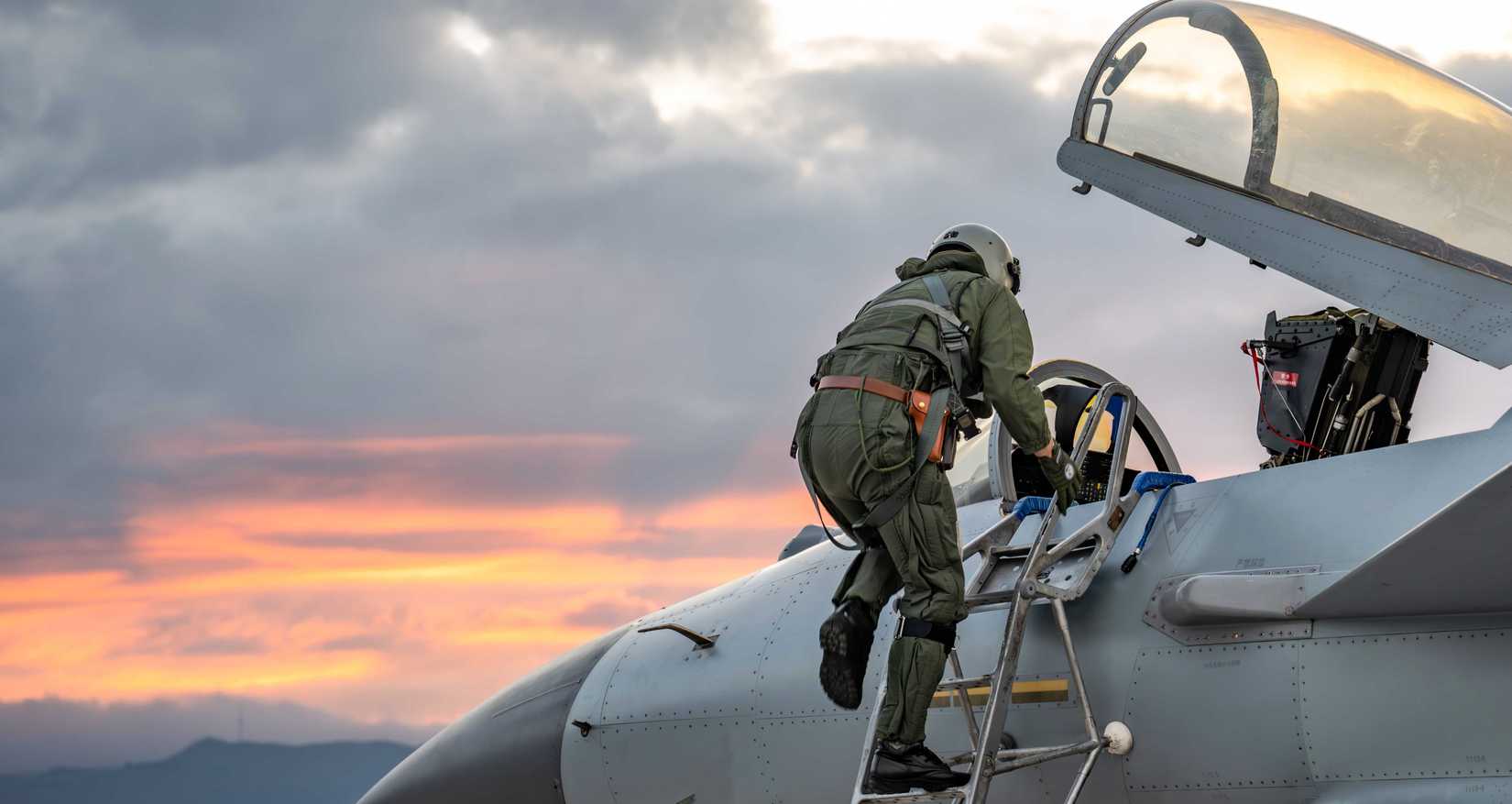 A pilot assigned to an aviation brigade of the air force under the Chinese PLA Southern Theater Command climbs into the cockpit of a J-10 fighter jet during a flight training exercise on September 17, 2025.