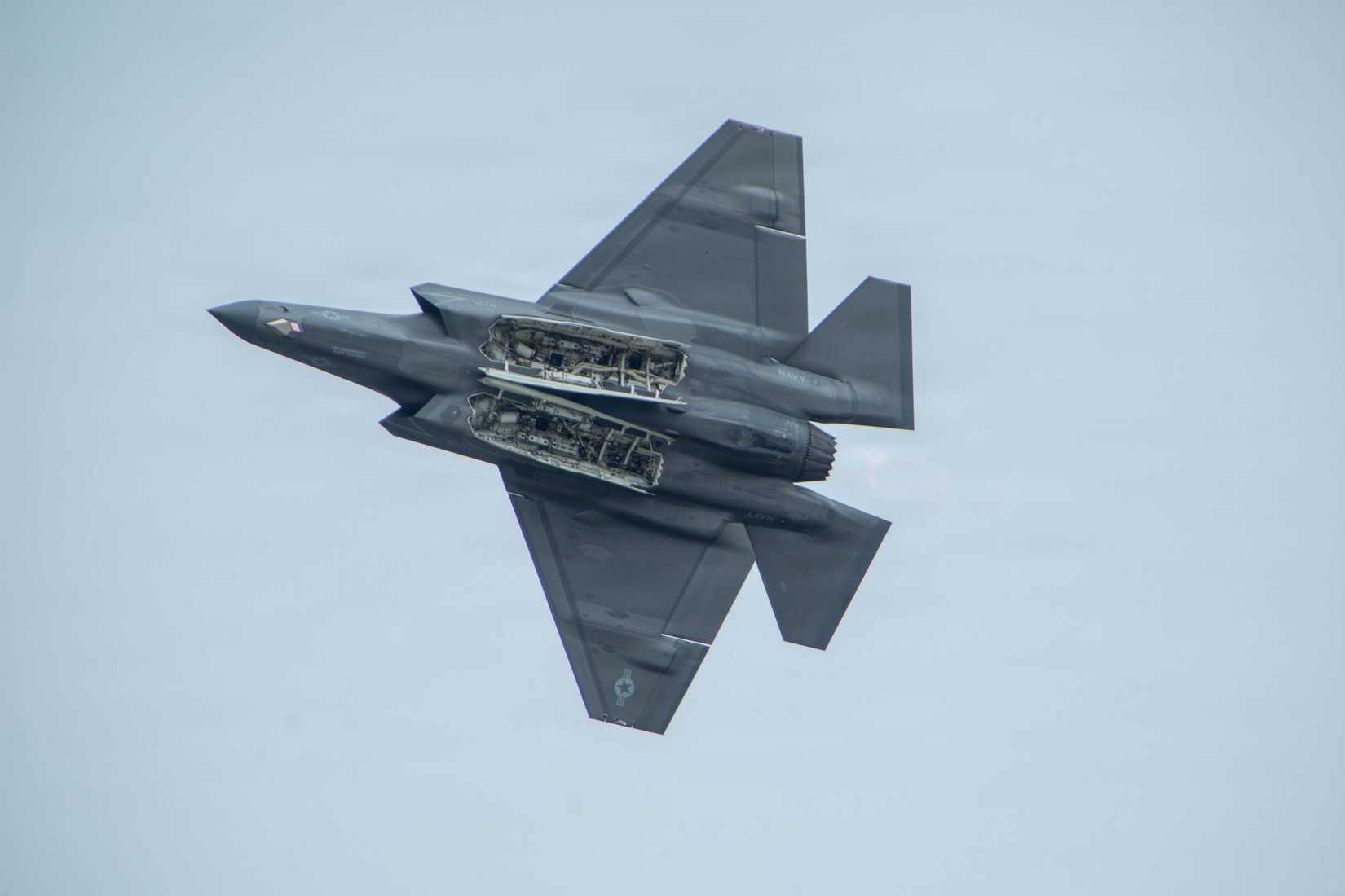 A U.S. Navy F-35C Lightning II aircraft with Strike Fighter Squadron (VFA) 147, Carrier Air Wing 5, conducts a flight demonstration during Family Day.