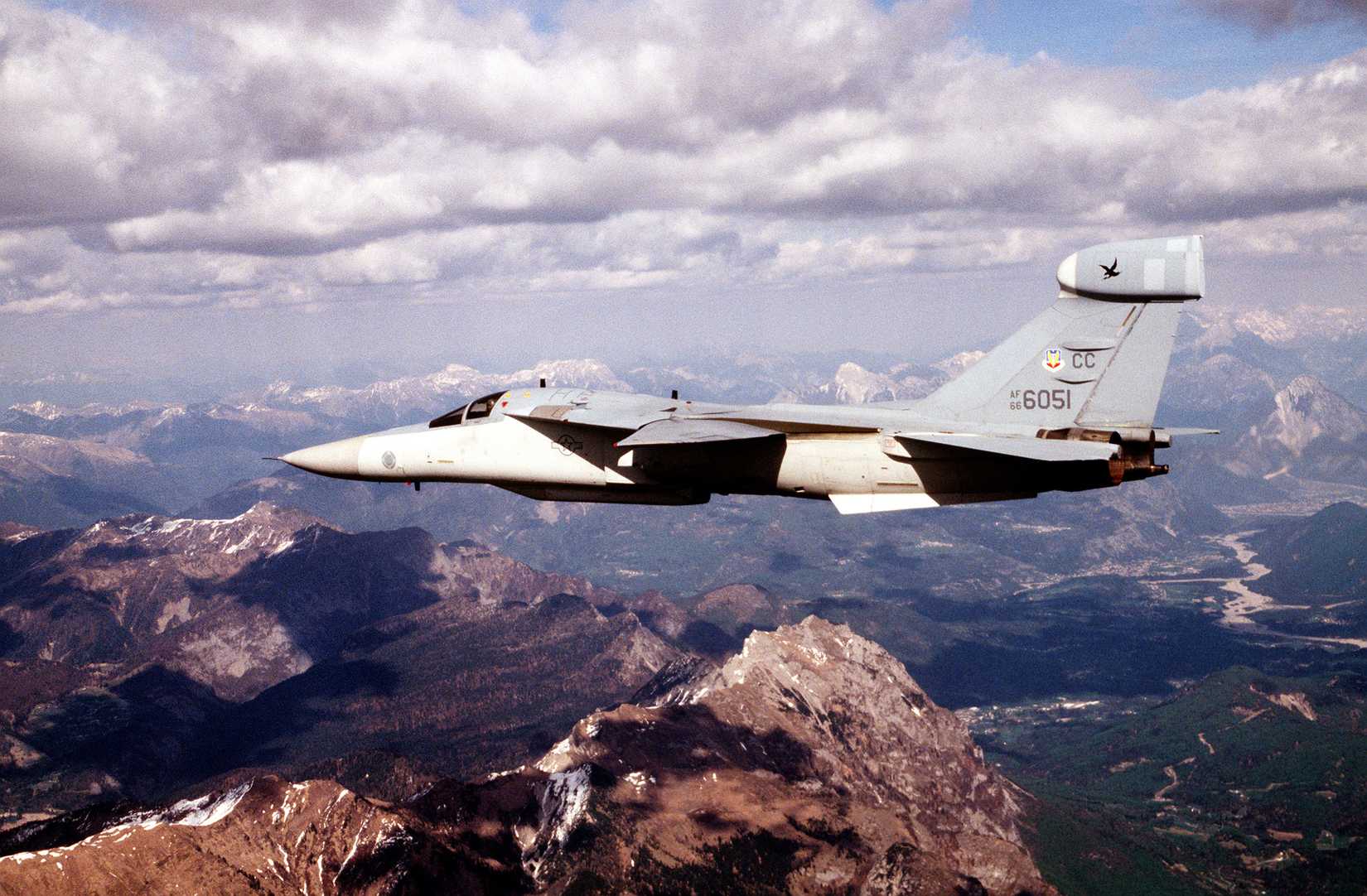A US Air Force EF-111 Raven deployed to Aviano Air Base, Italy, from the 429th Electronic Combat Squadron, Cannon Air Force Base, NM, flies over the Alps of Northern Italy.