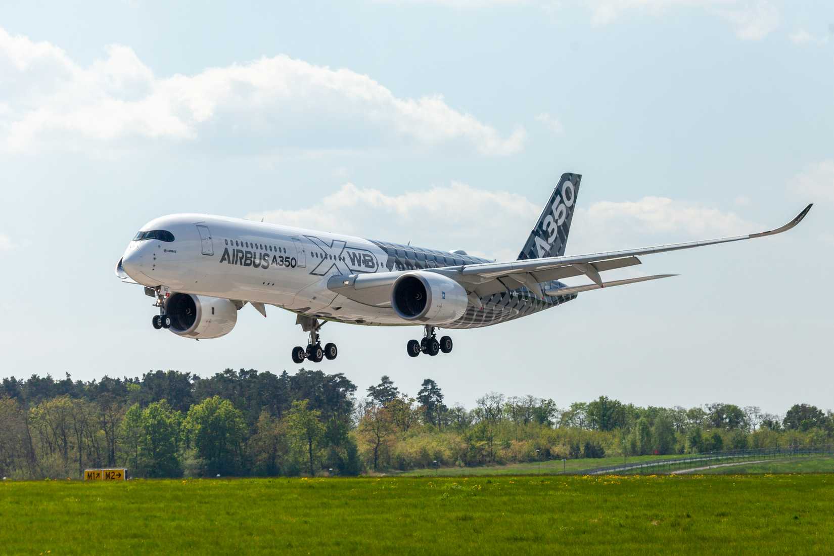 A350-900 carbon fiber livery flying low