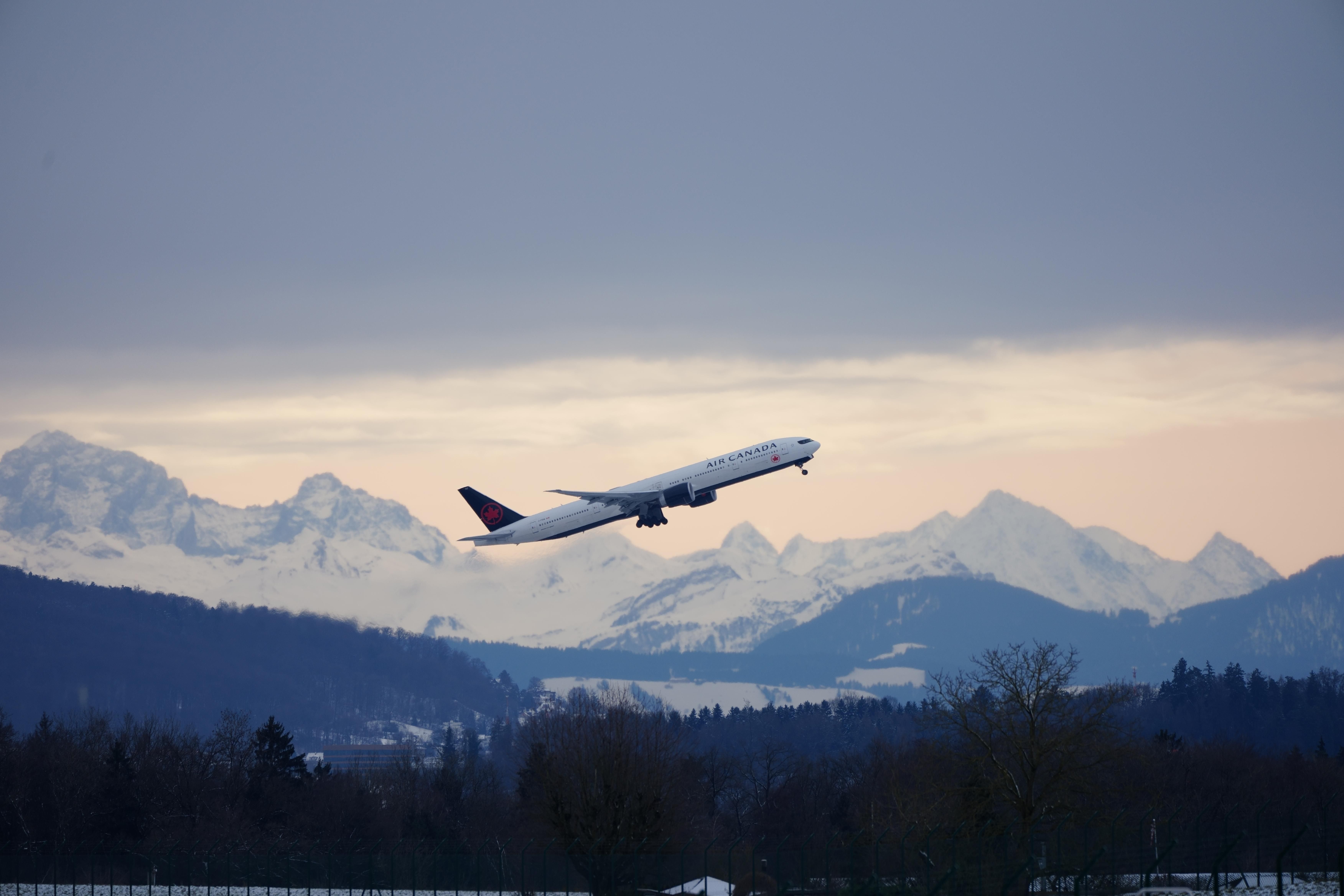 Air Canada Aircraft Taking off With Mountains In Background