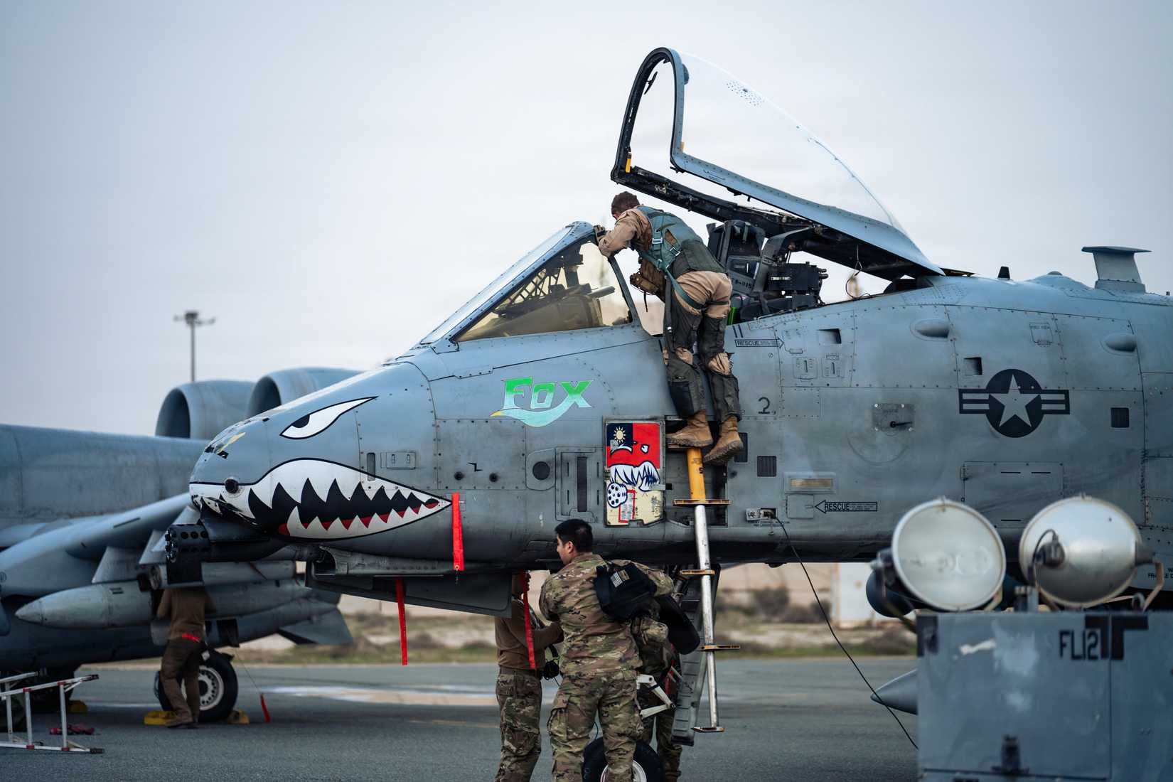 Air Force A-10C Thunderbolt II aircraft pilot assigned to the 75th Expeditionary Fighter Squadron exits an A-10 at a base in the U.S. Central Command area of responsibility.