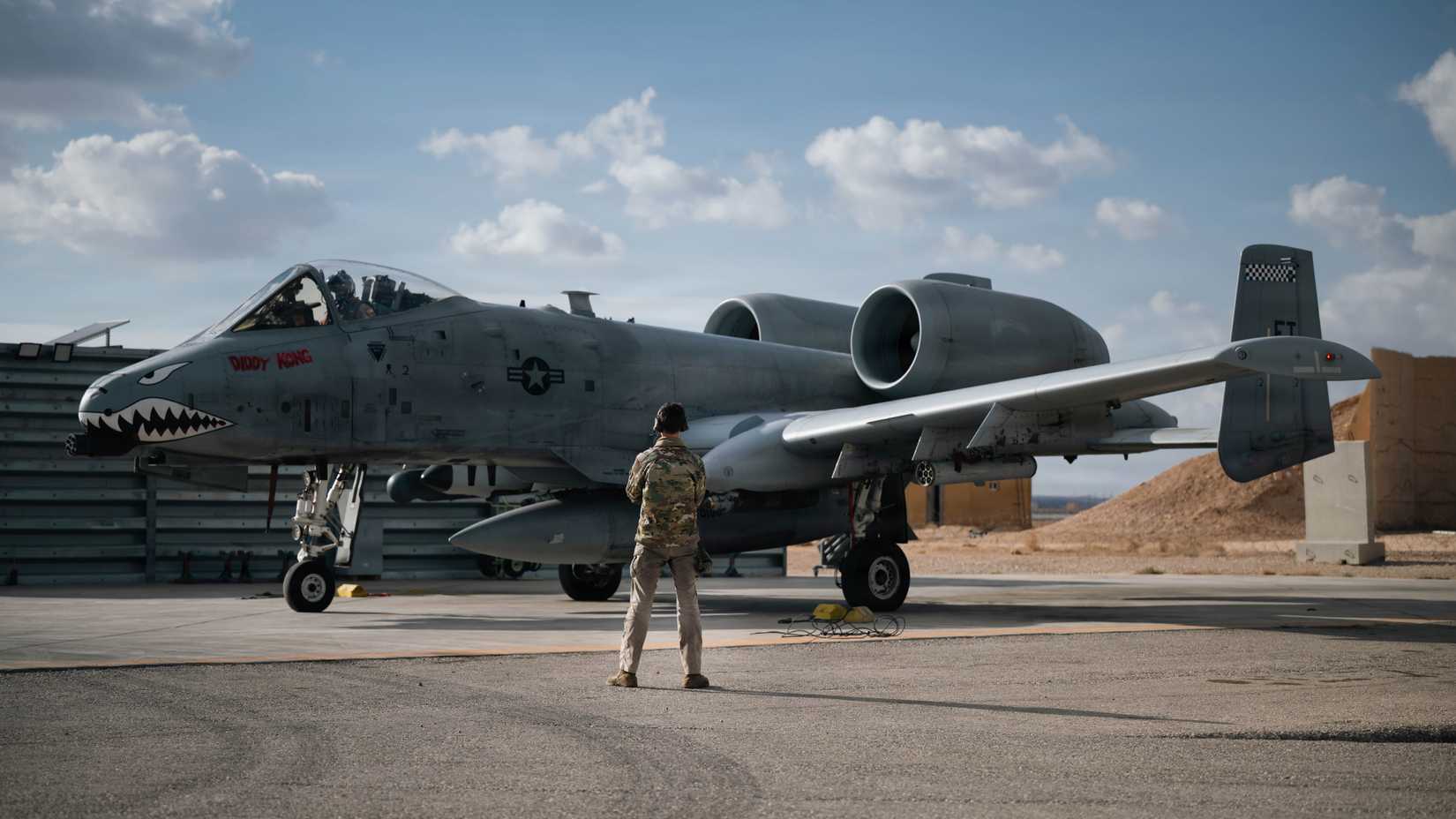 Air Force Airman 1st Class Isaac Baker, 75th Expeditionary Fighter Generation Squadron crew chief, performs pre-flight checks on an A-10C Thunderbolt II.