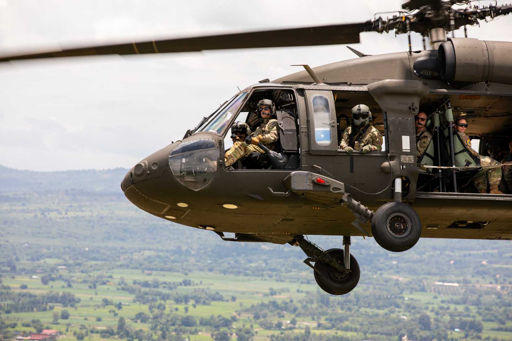Air Force Brig. Gen. Kenneth Borchers, Washington Air National Guard commander, rides in a Washington Army National Guard UH-60M Black Hawk piloted by U.S. Army Chief Warrant Officer 3 Jarin Trakel,