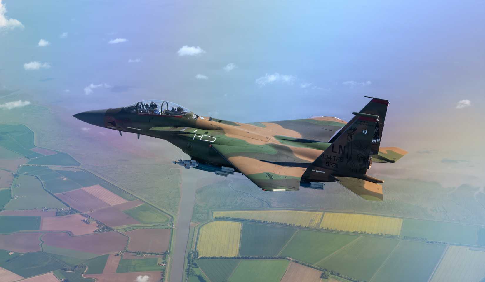 Air Force F-15E Strike Eagle aircraft assigned to the 494th Fighter Squadron flies with a heritage paint scheme for the first time above the United Kingdom, May 7, 2026.