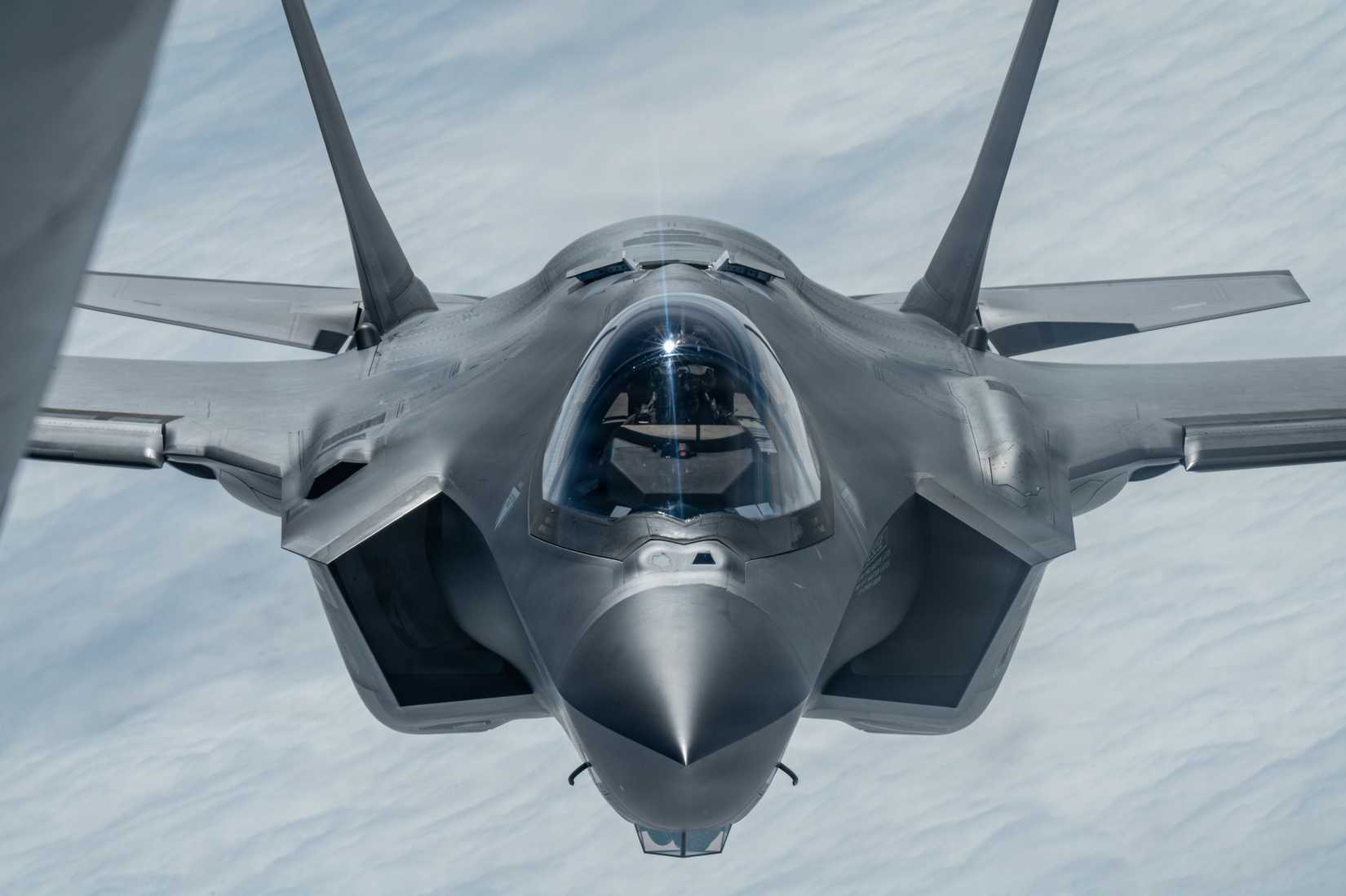 Air Force F-35 Lightning II assigned to the 48th Fighter Wing, approaches a KC-135 Stratotanker assigned to the 100th Air Refueling Wing.