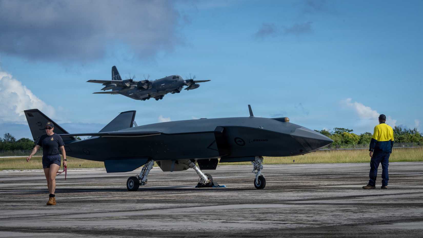 Air Force HC-130J Combat King II assigned to the 79th Rescue Squadron takes off behind a Boeing Defence Australia’s MQ-28 Ghost Bat