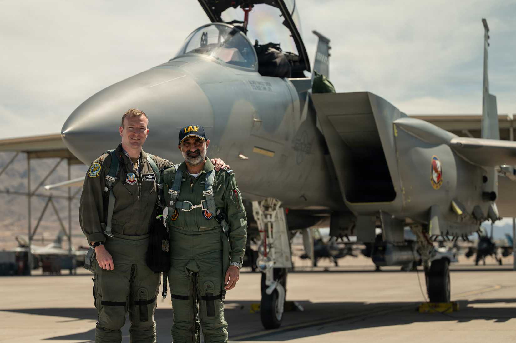 Air Force Maj. Matthew Benson and Indian Air Force Air Chief Marshal Amar Preet Singh pose for a photo before an F-15EX familiarization flight