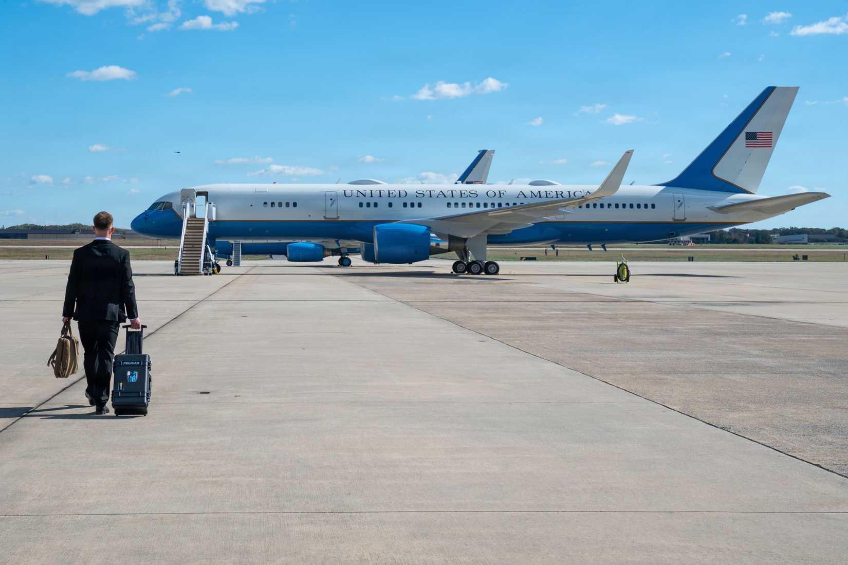 Air Force Senior Airman Steven Mittelstadt, 816th Security Forces Squadron executive aircraft security member, walks towards a C-32A at Joint Base Andrews, Maryland, Oct. 20, 2025.