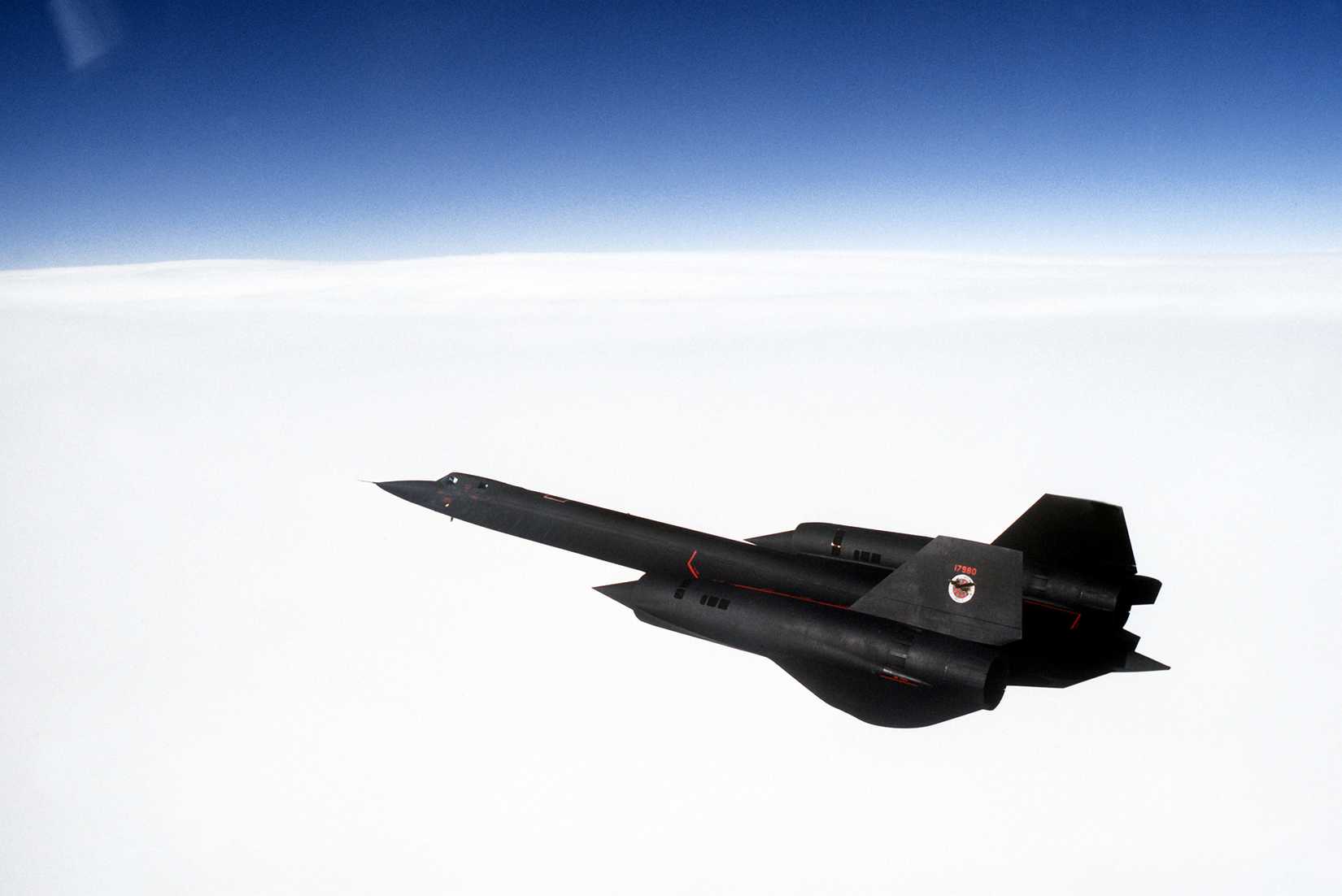 Air to air view left side above view of a 9th Strategic Reconnaissance Wing's SR-71 Blackbird reconnaissance aircraft.