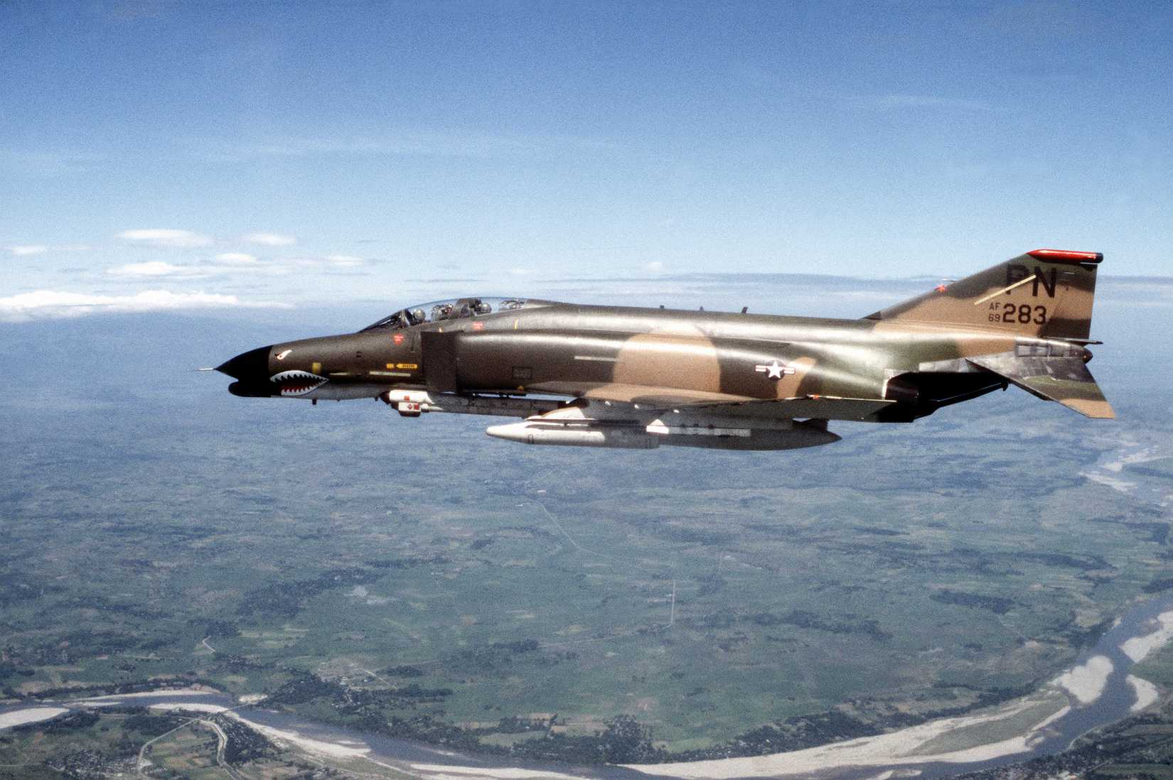 An air-to-air left side view of an F-4G Phantom II Advanced Wild Weasel aircraft.