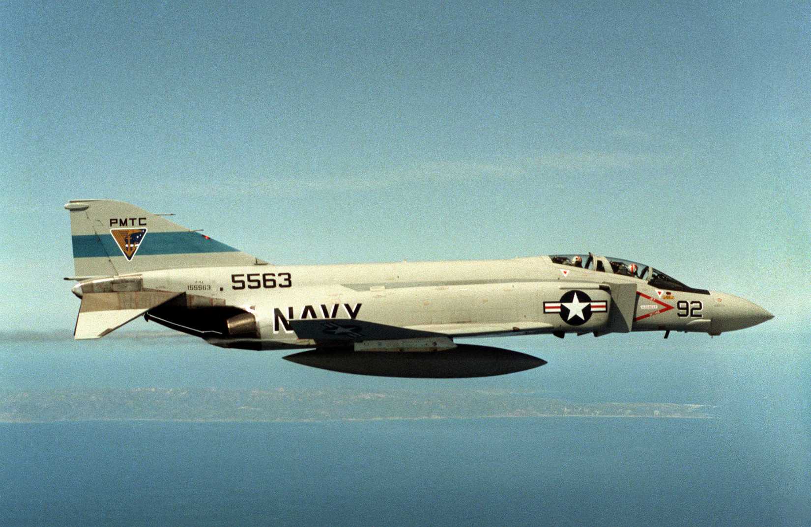 An air-to-air right side view of an F-4 Phantom II aircraft from USN Pacific Missile Test Center.