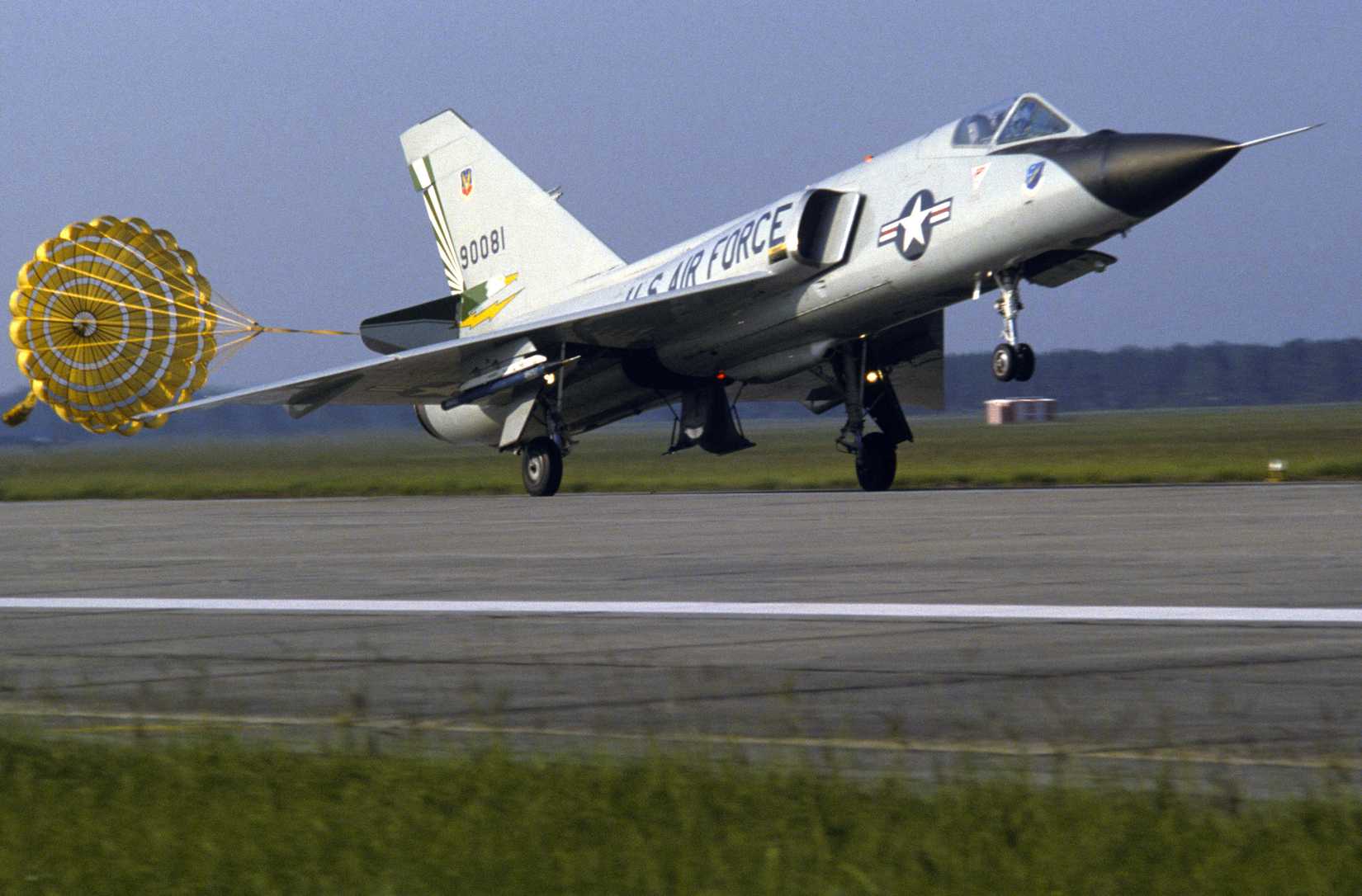 An F-106 Delta Dart aircraft from the 49th Fighter Interceptor Squadron deploys a drogue chute upon landing.