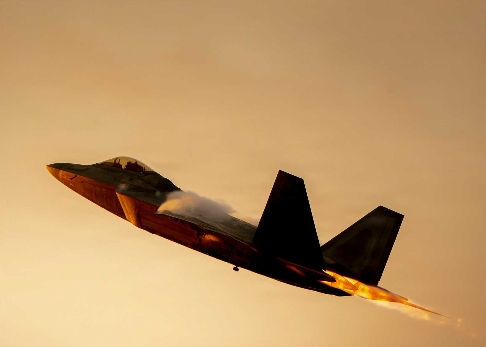 An F-22 Raptor Aerial Demonstration Team, performs an aerial demonstration during the 52nd Annual SUN 'n FUN Aerospace Expo in Lakeland, Florida