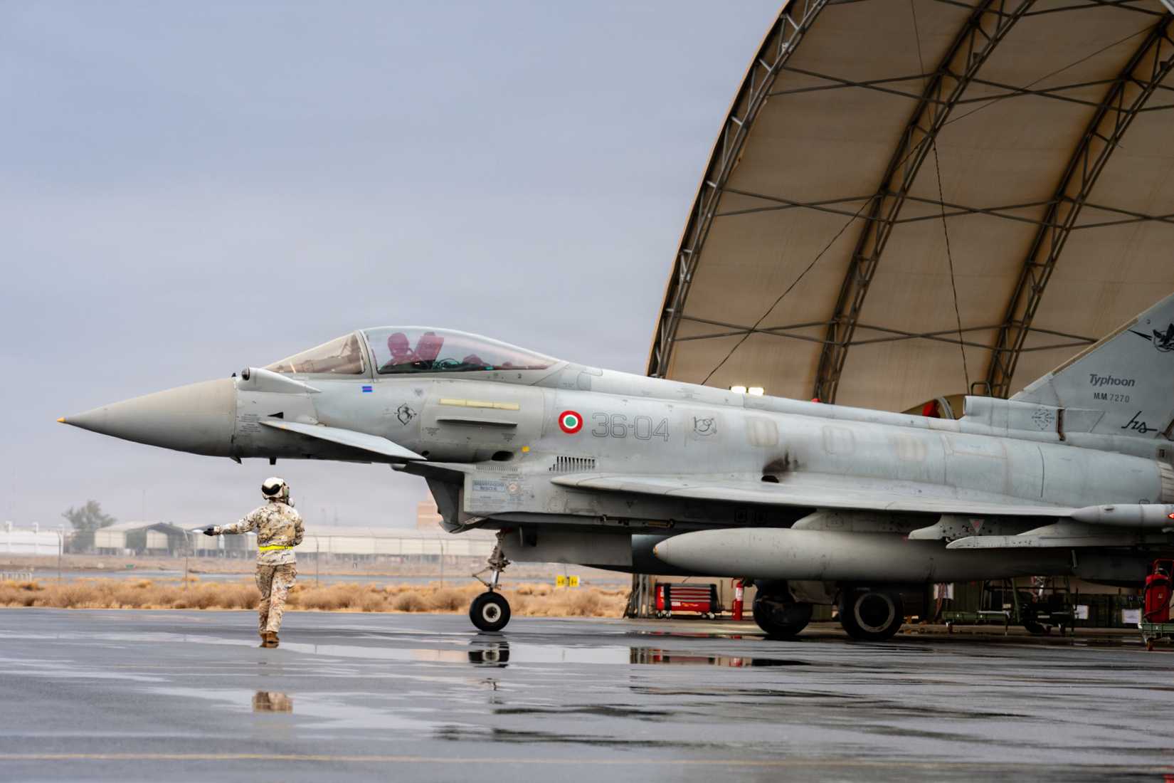 An Italian Air Force airman marshals an Italian Air Force Eurofighter Typhoon during Exercise Blue Sands 26.1.