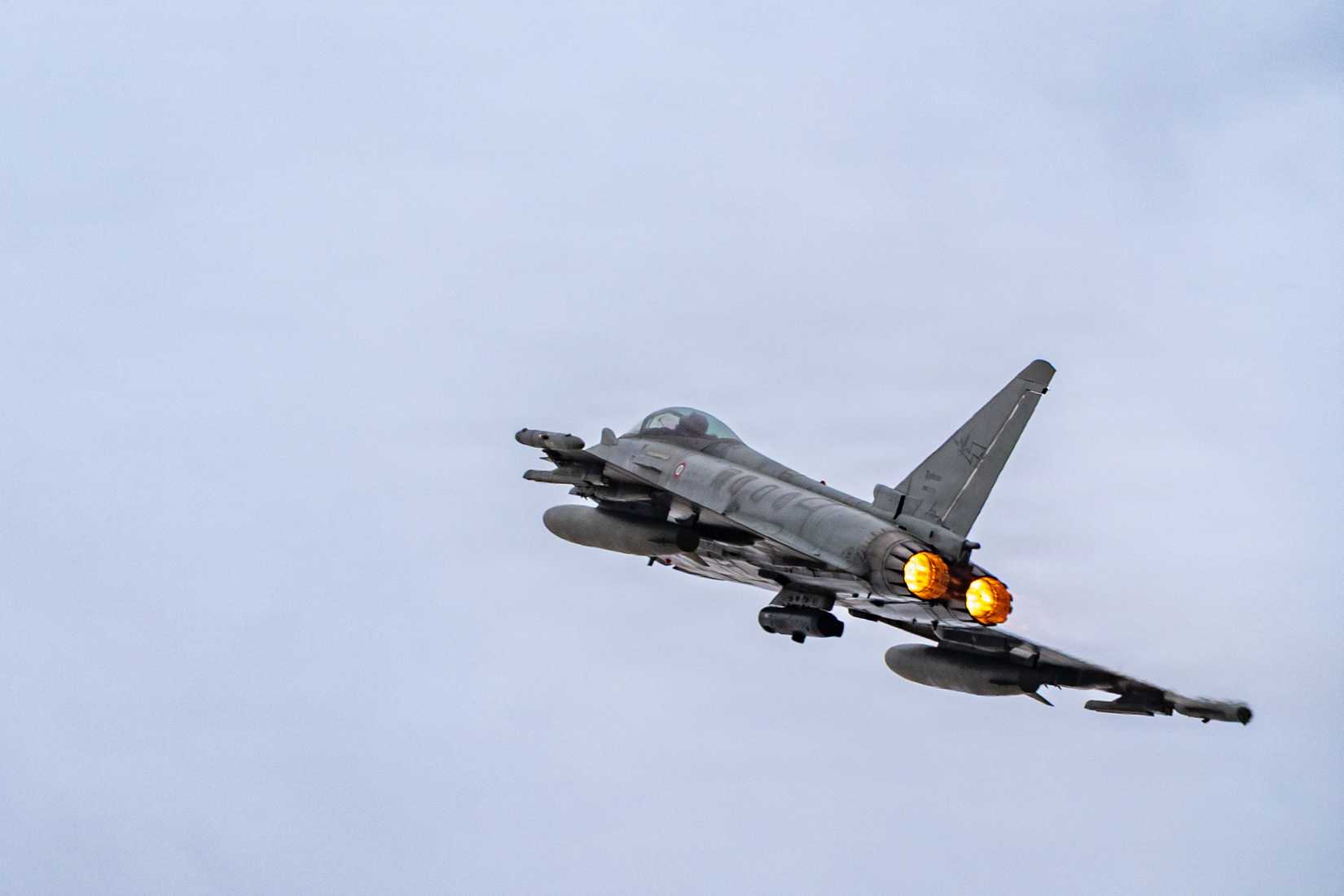 An Italian Air Force Eurofighter Typhoon banks right in the air during Exercise Blue Sands 26.1 within the U.S. Central Command area of responsibility, Dec. 11, 2025.